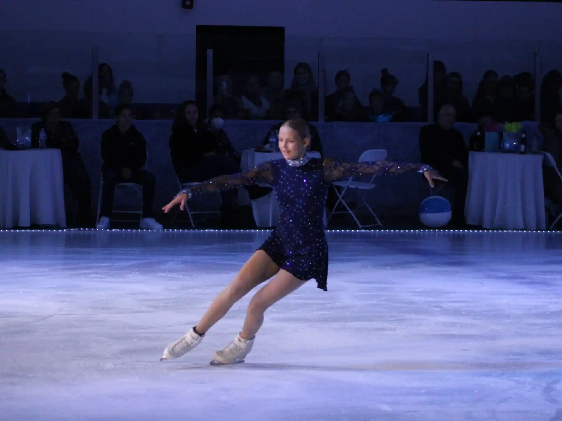a person wearing a dress and ice skating