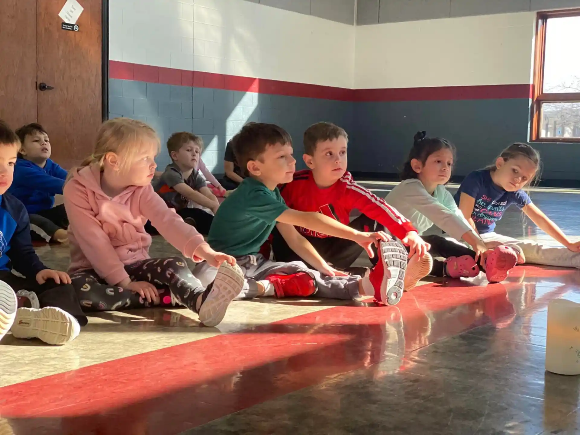 a group of children sitting on the floor