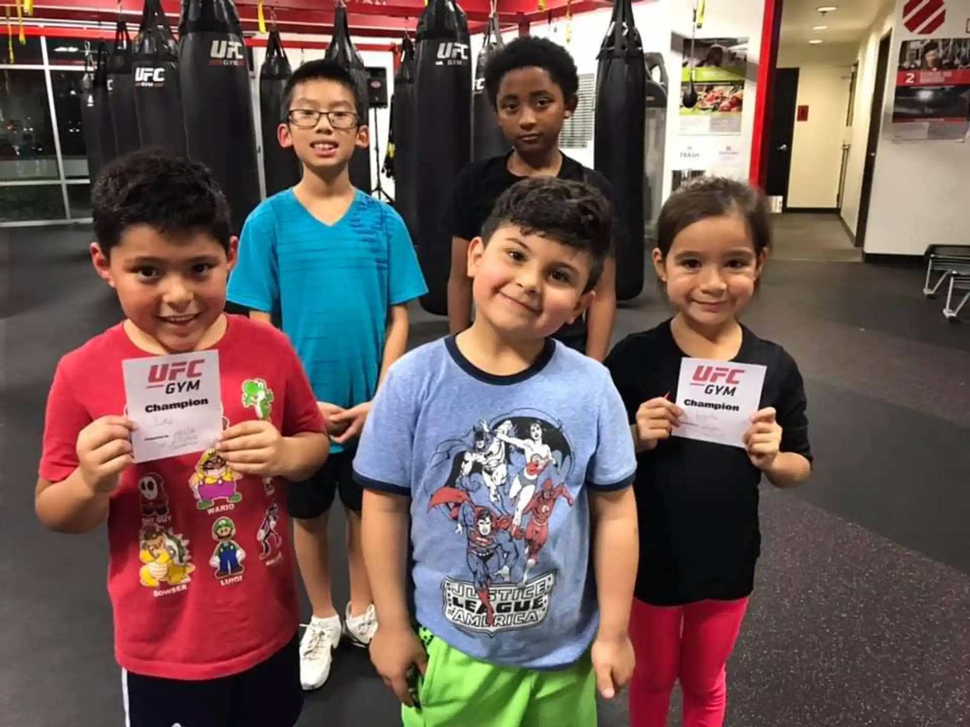 a group of children holding signs