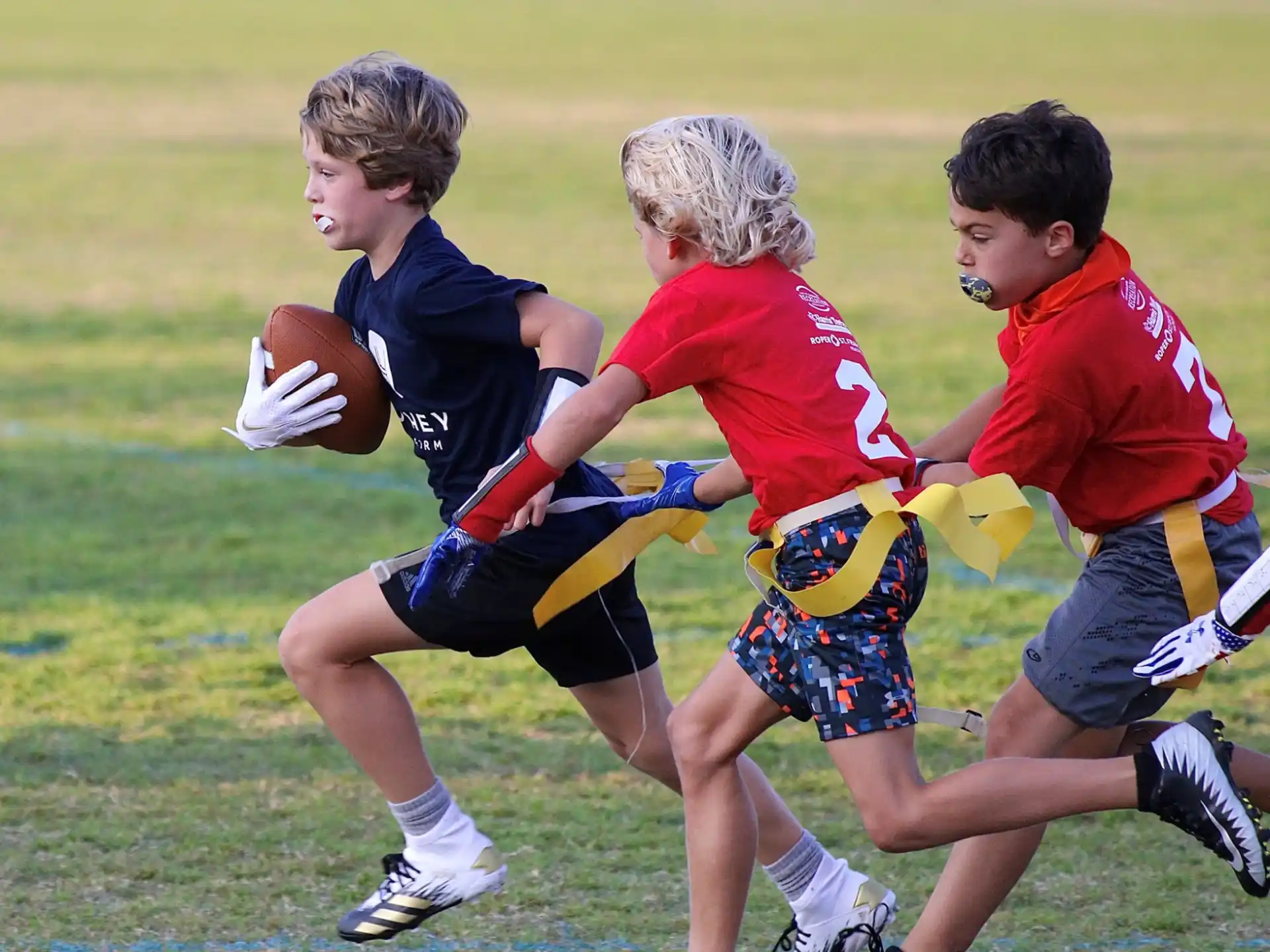a group of boys playing rugby