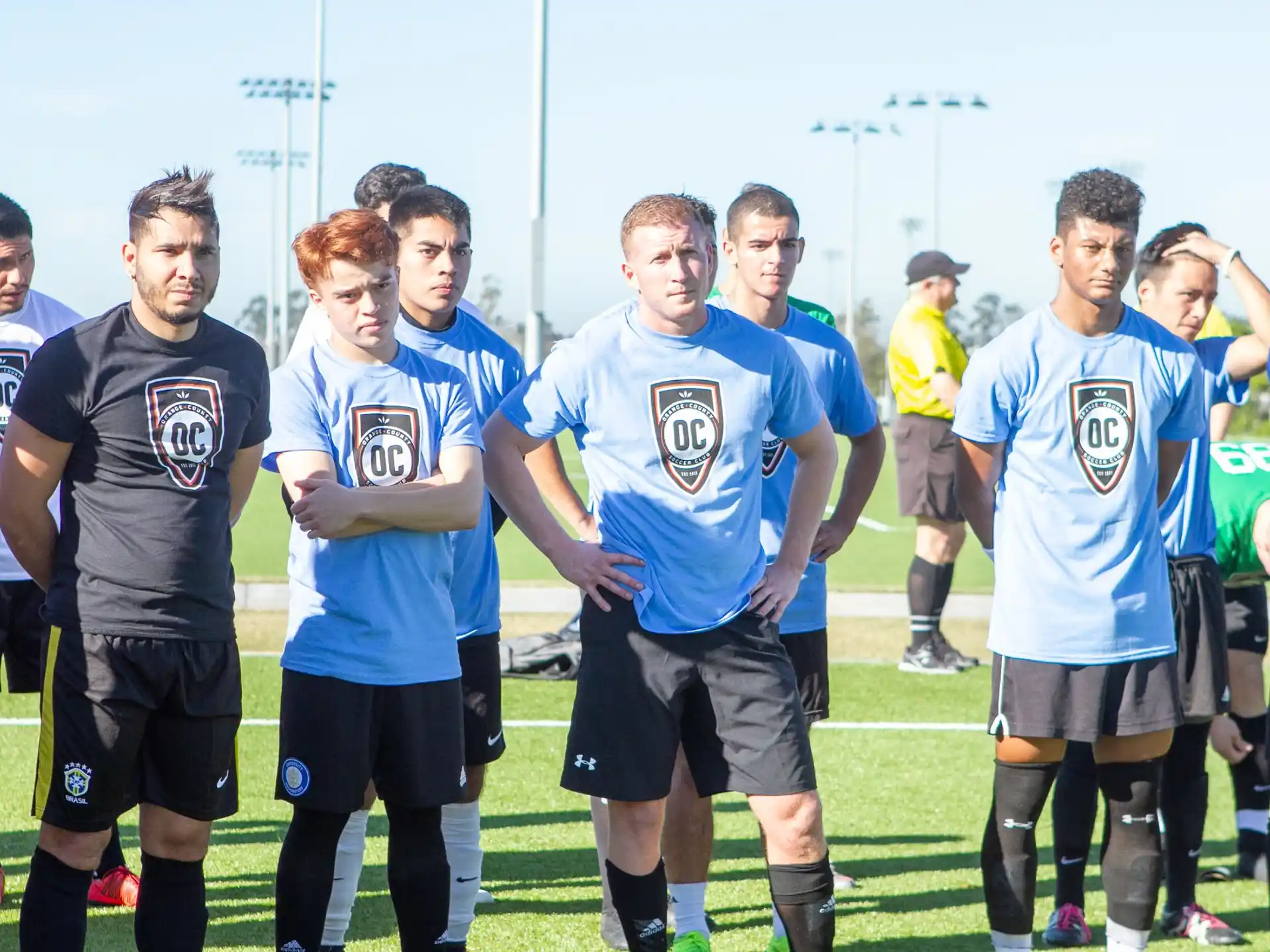 a group of men in sports uniforms