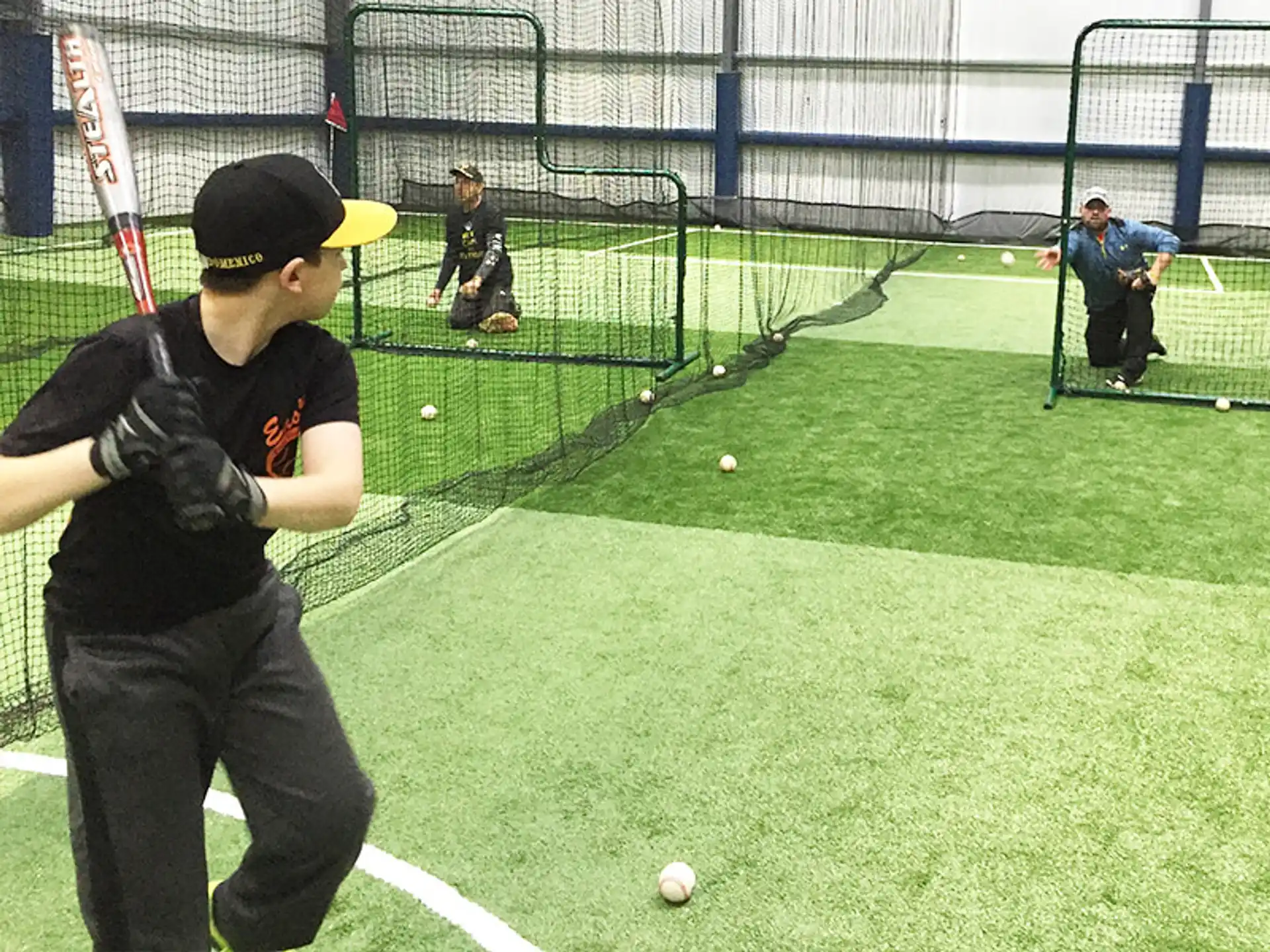 a person prepares to hit a baseball