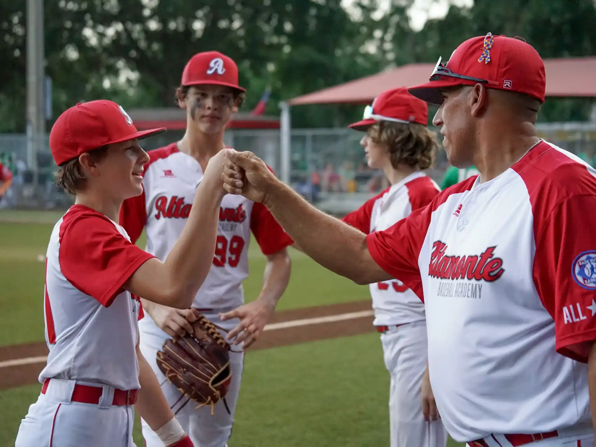 a group of baseball players shake hands
