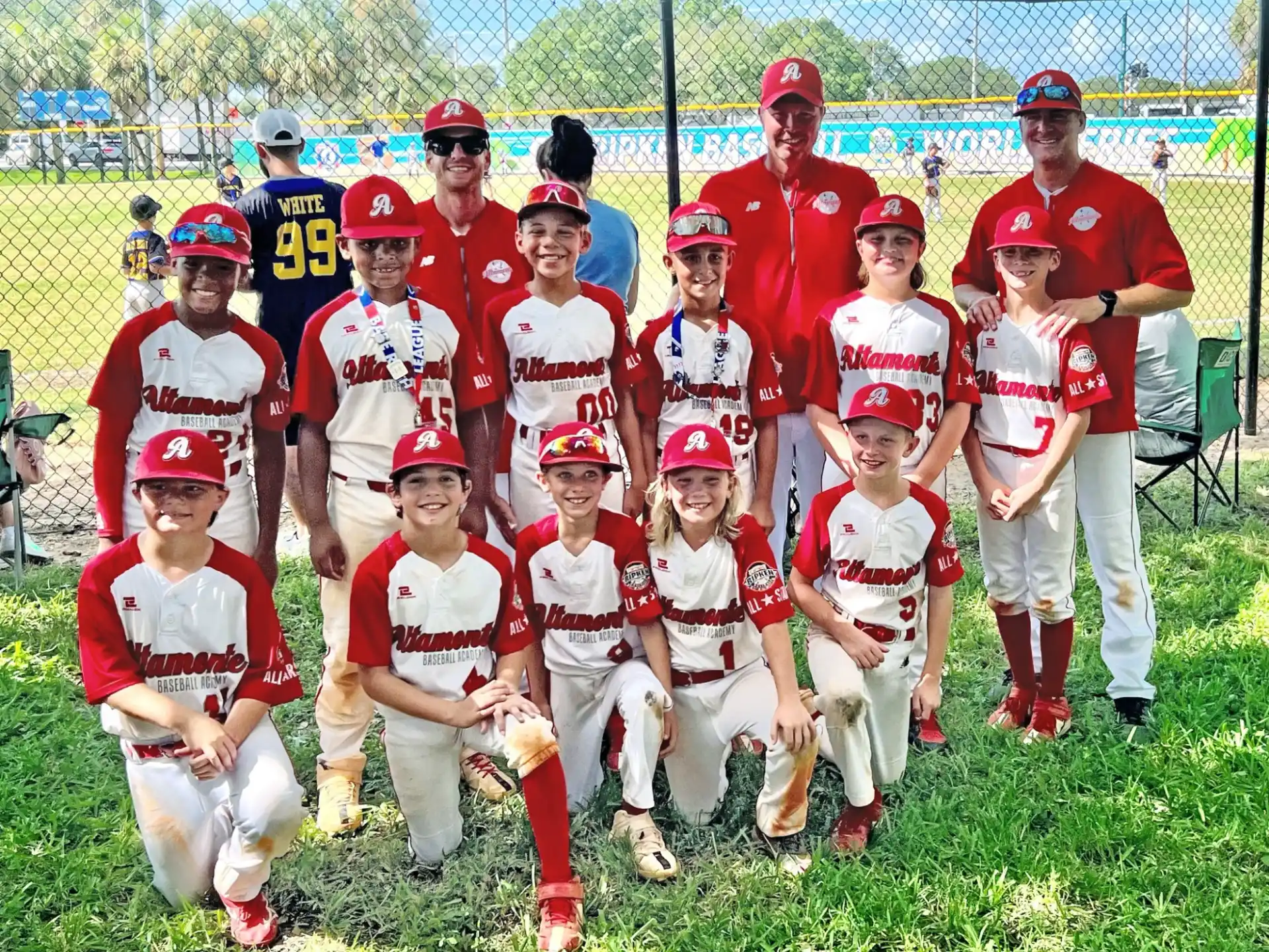 a group of kids in baseball uniforms