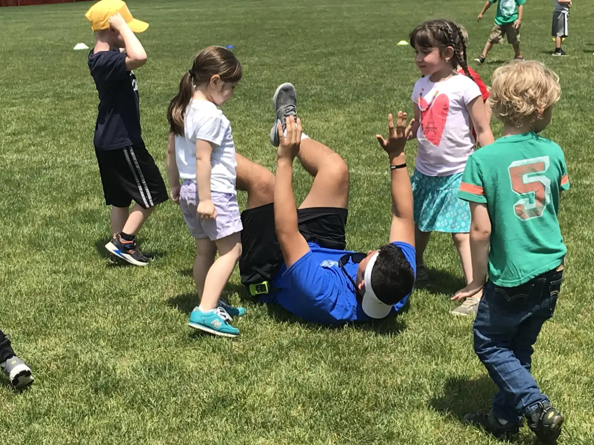 a group of children playing in a field