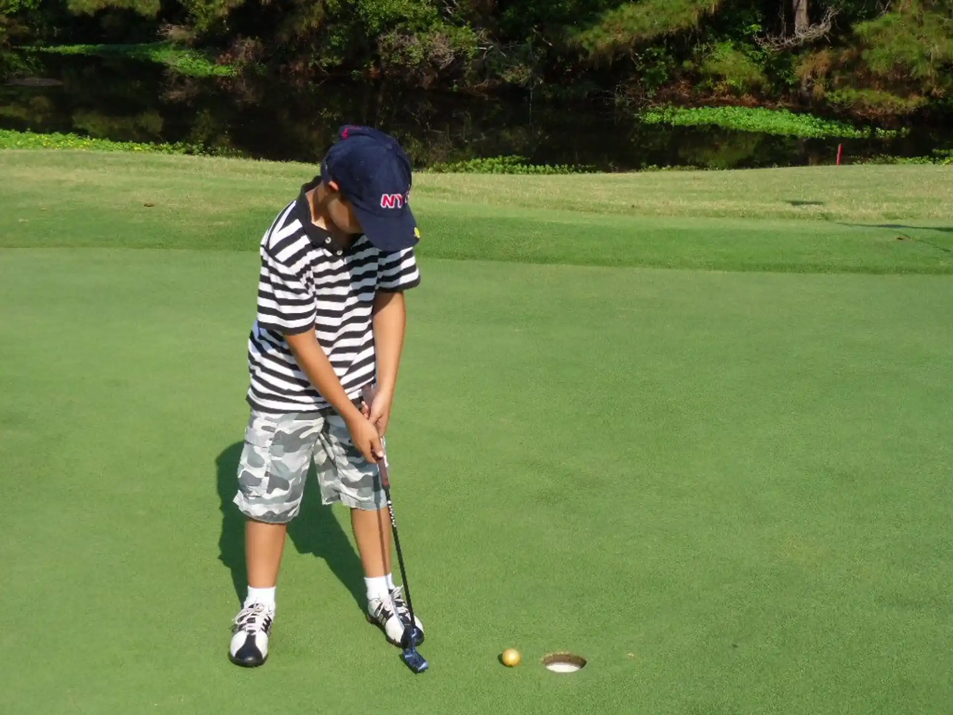 a boy playing golf