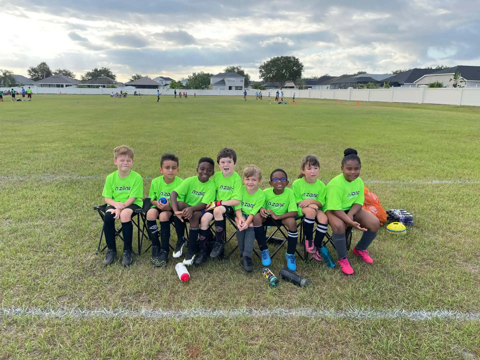a group of football players sitting on a field