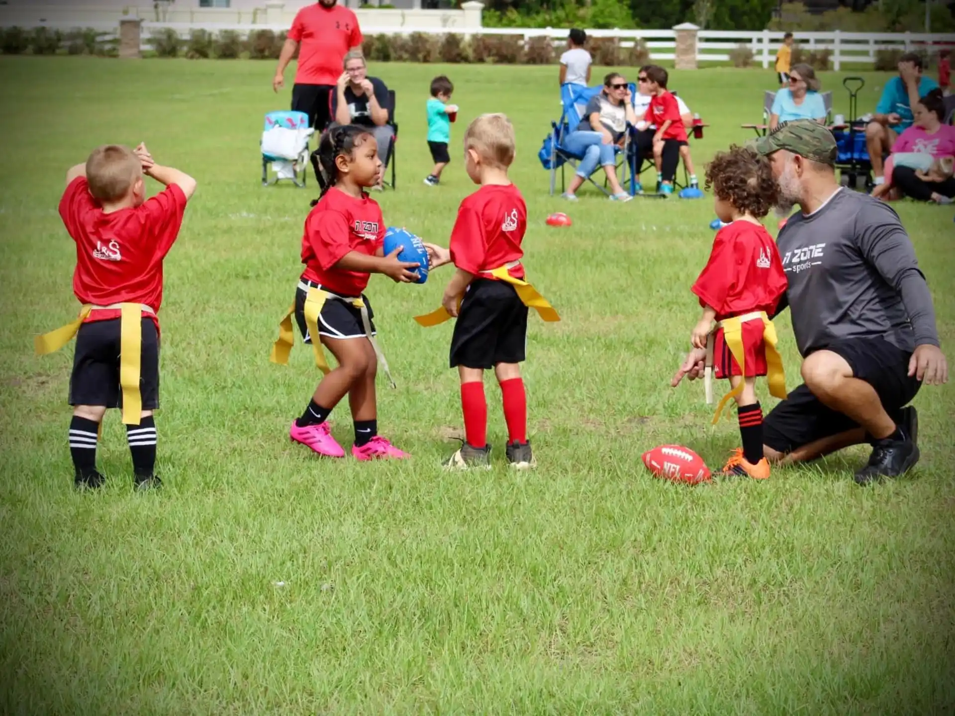 a group of kids playing football