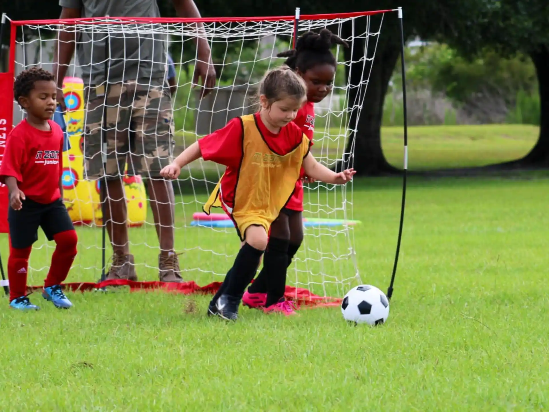 kids playing football on a field