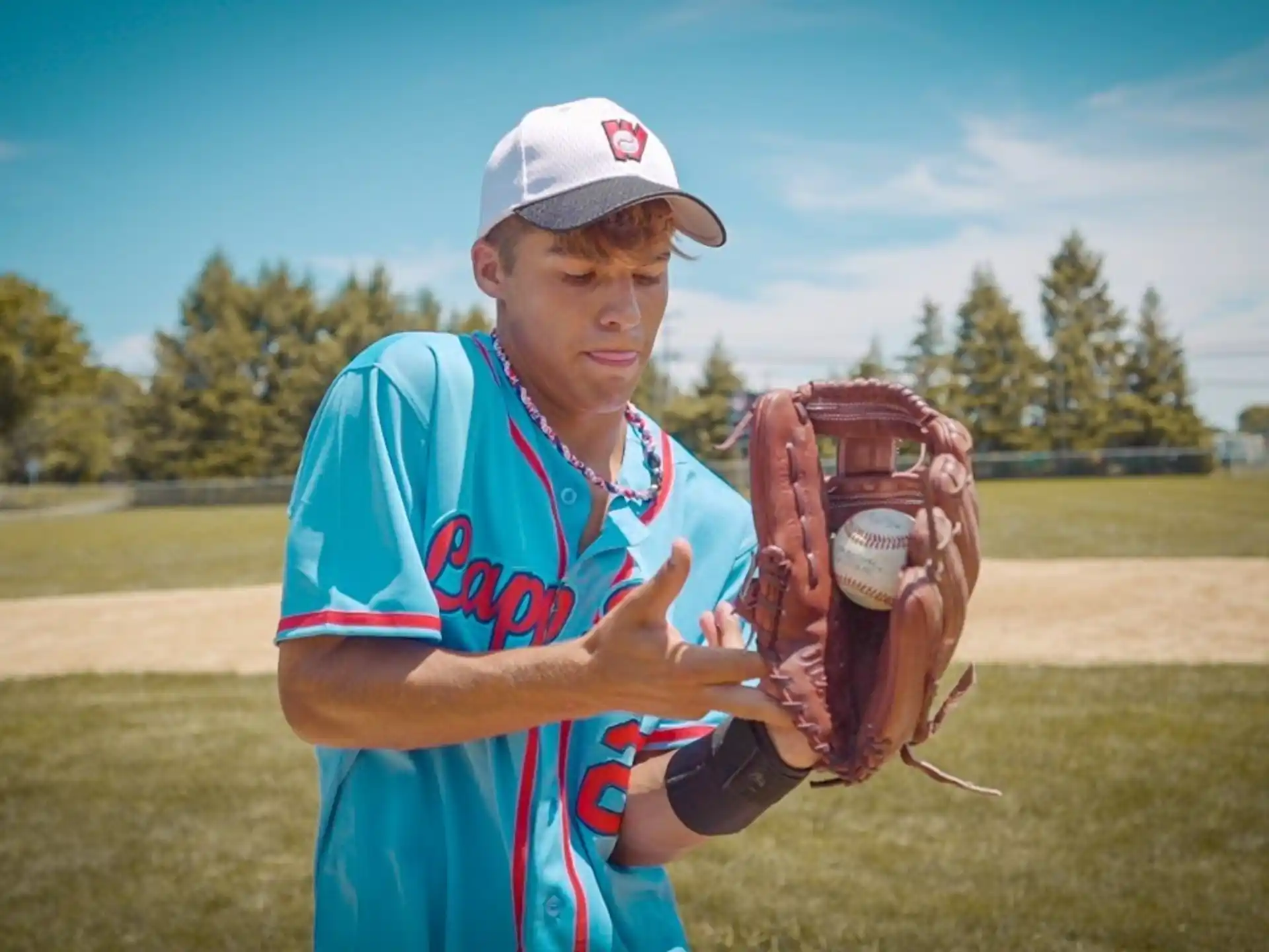 a person holding a baseball