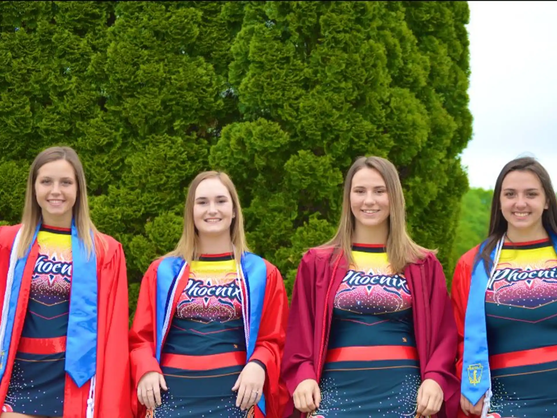 a group of girls in colorful uniforms