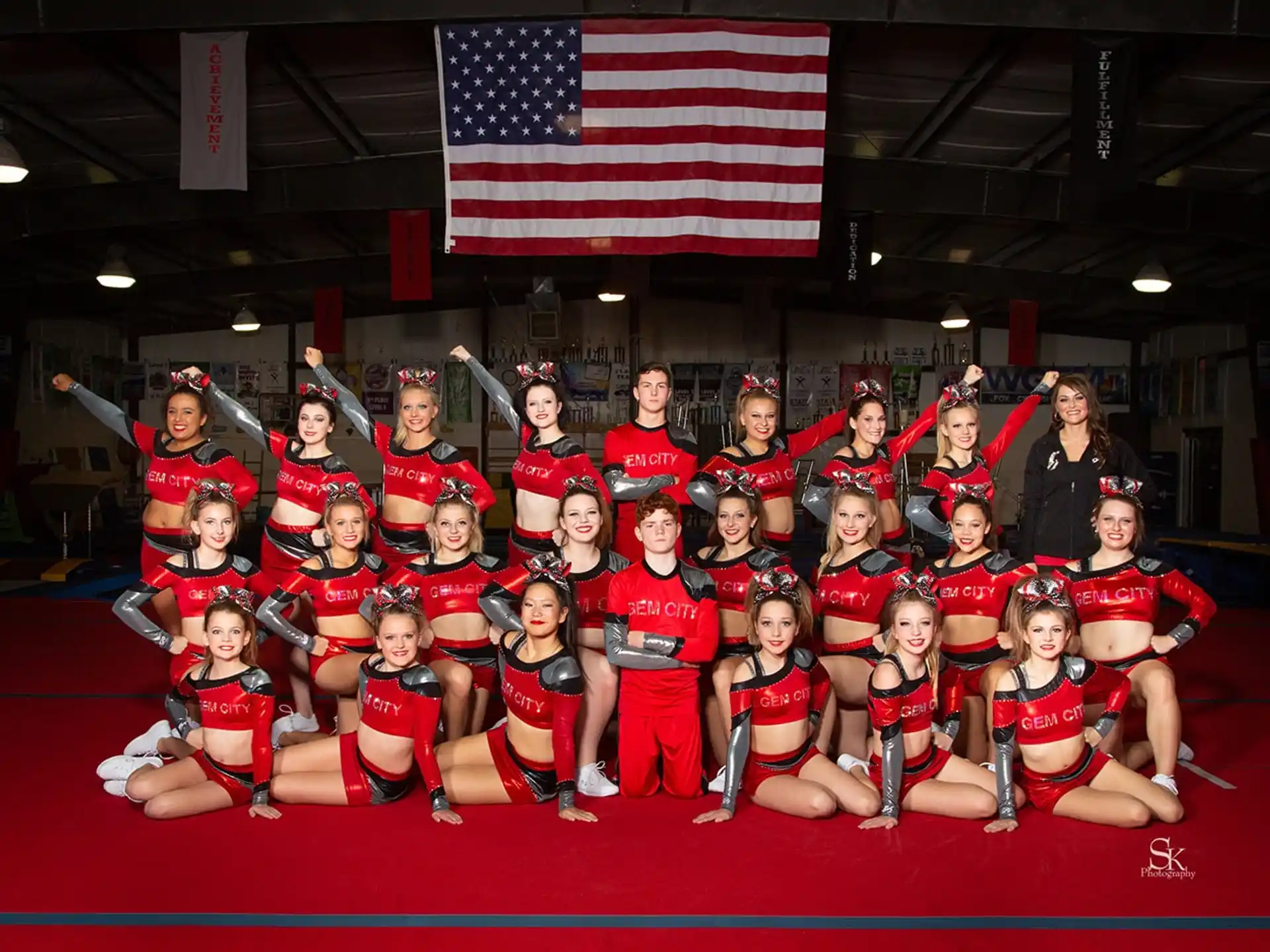a group of people in red uniforms posing for a photo