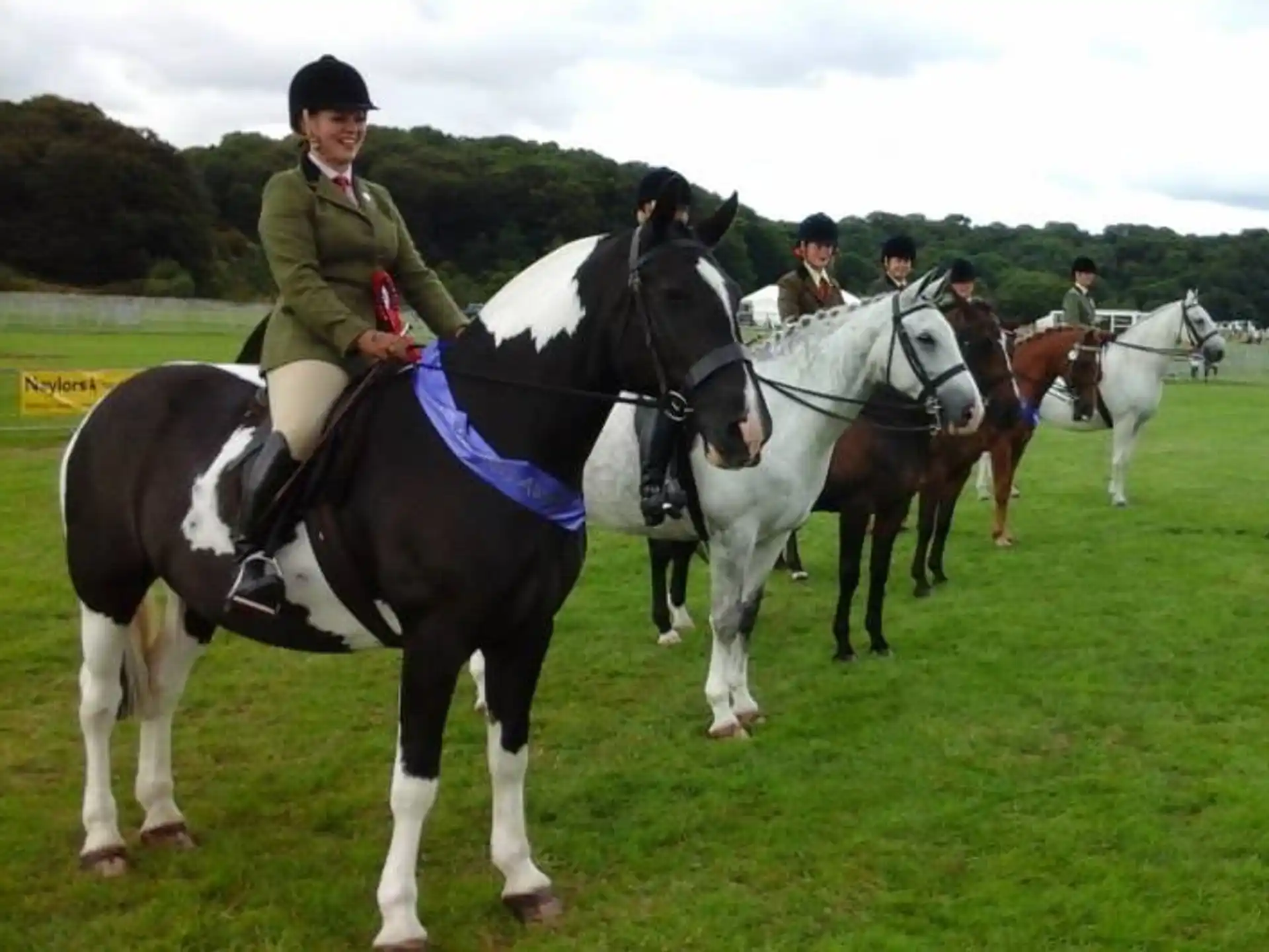 a group of people riding horses