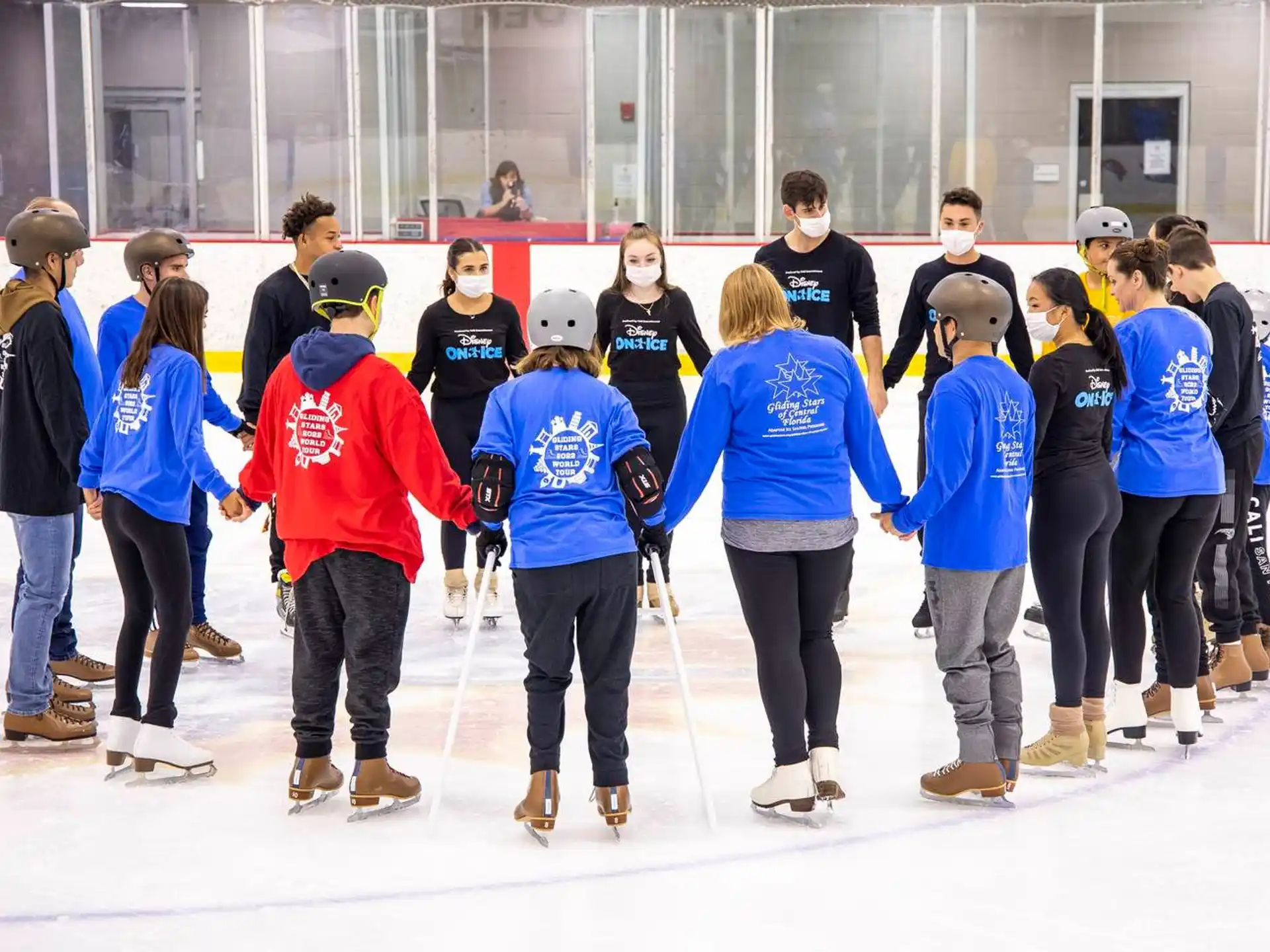 a group of people standing on ice