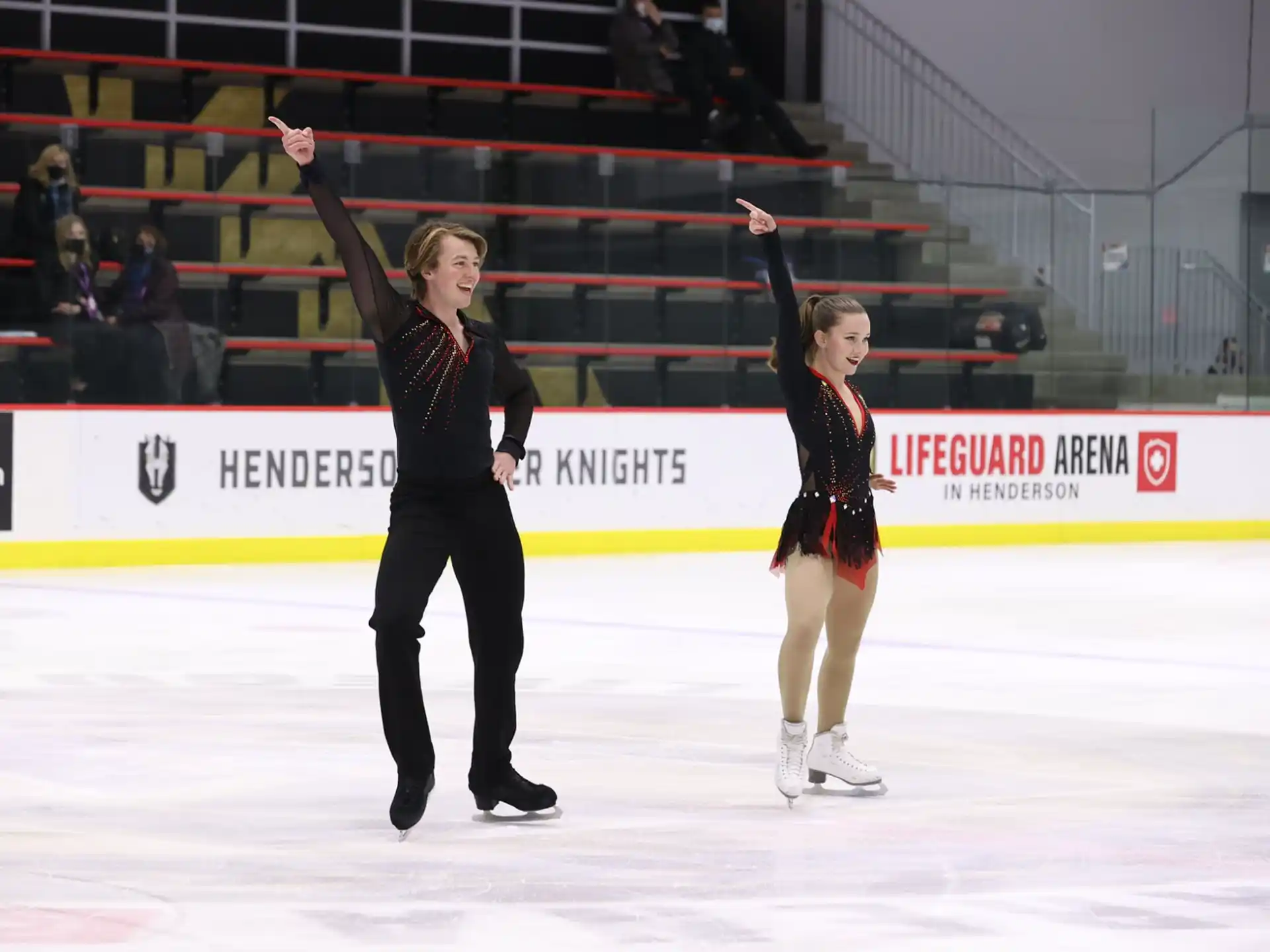 a man and woman ice skating