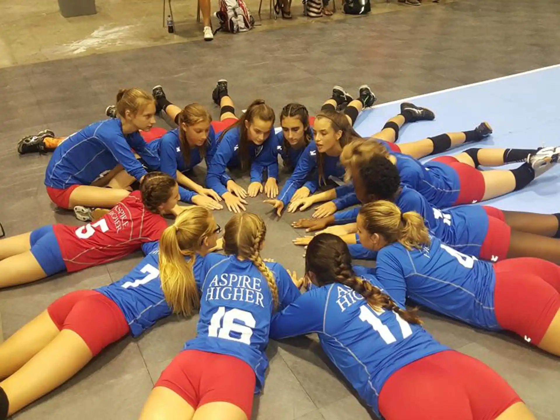 a group of people in a huddle