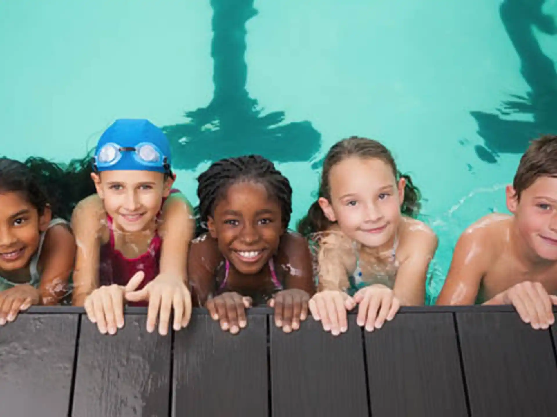 a group of children in a pool