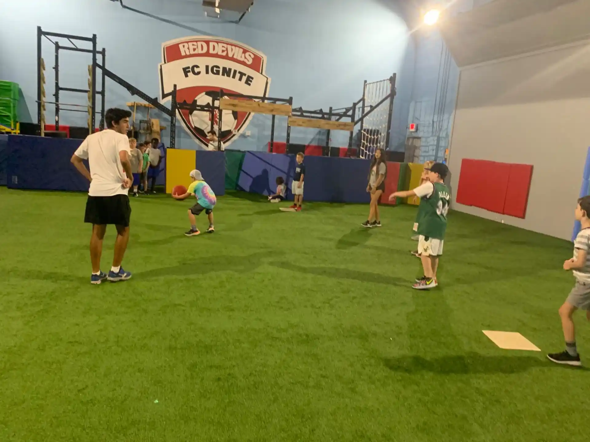 a group of people playing basketball