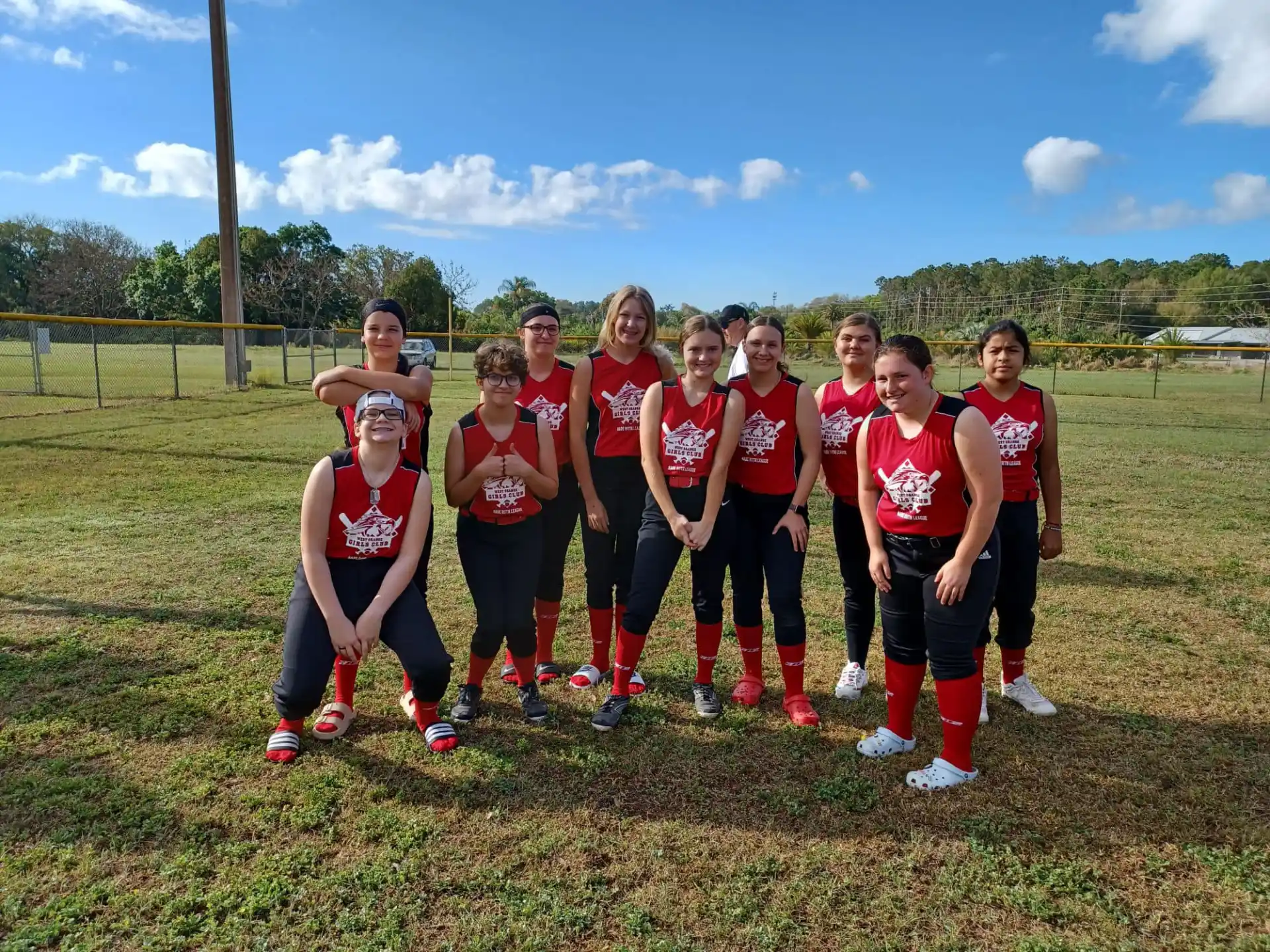 a group of girls in red uniforms
