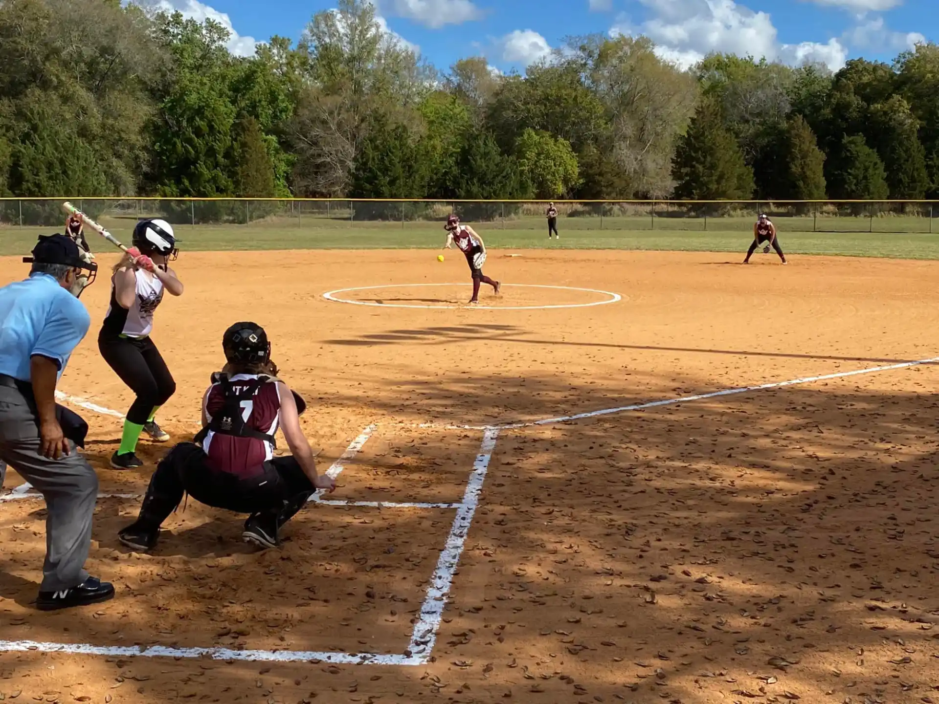 a group of people playing baseball