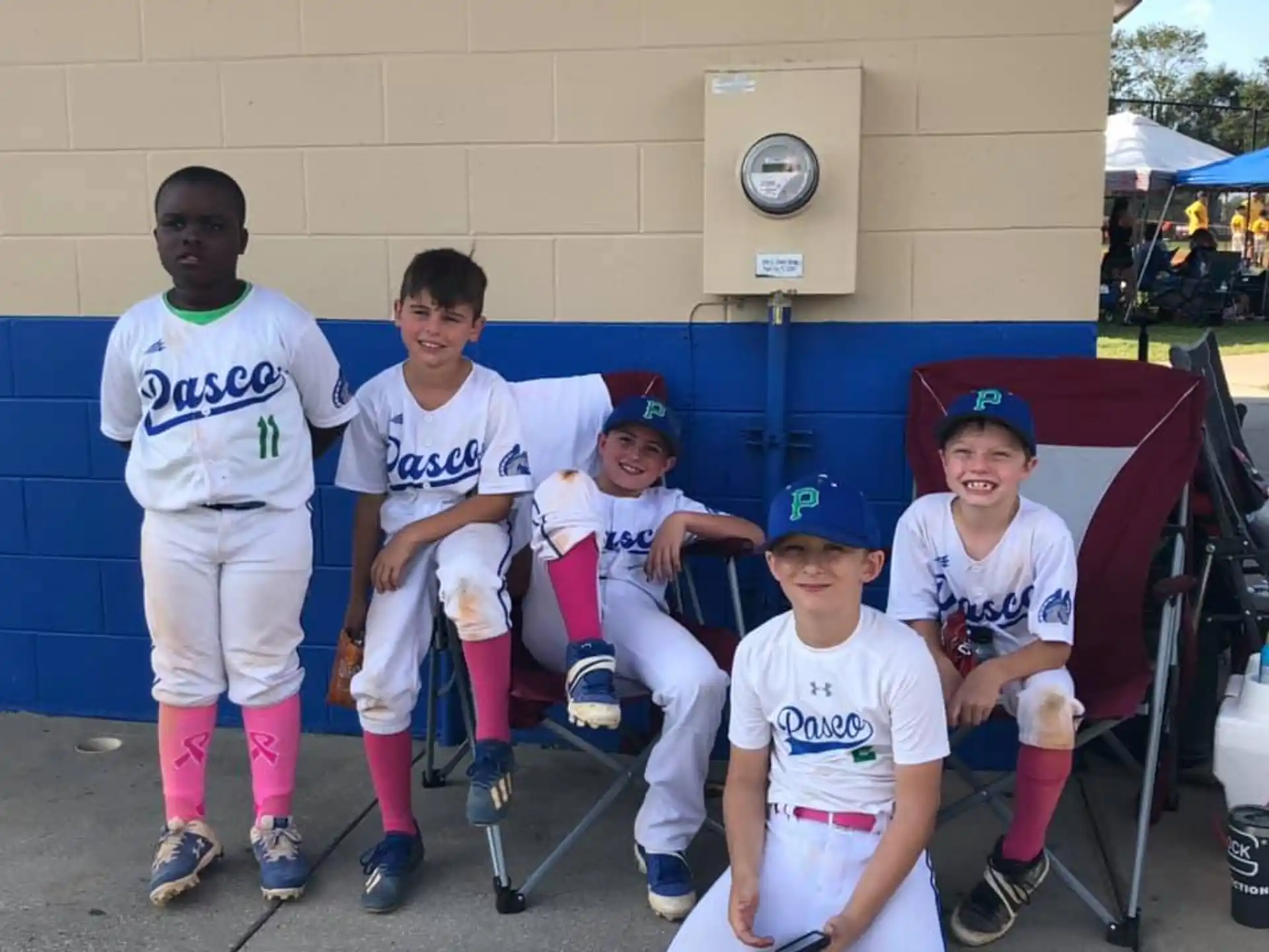 a group of boys in baseball uniforms