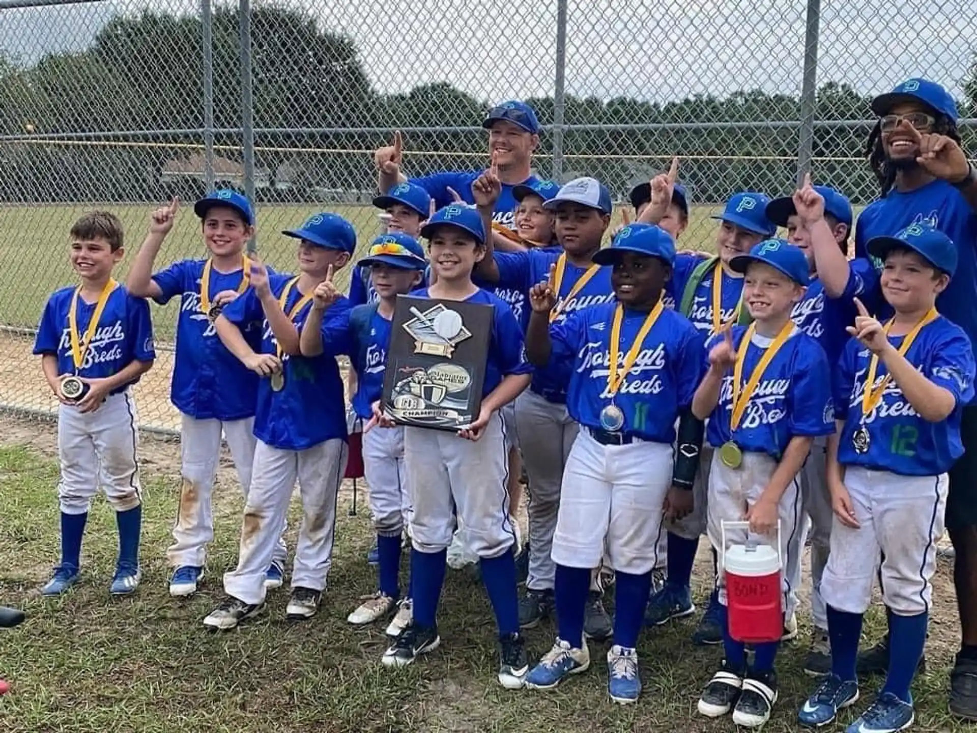 a group of kids wearing blue uniforms