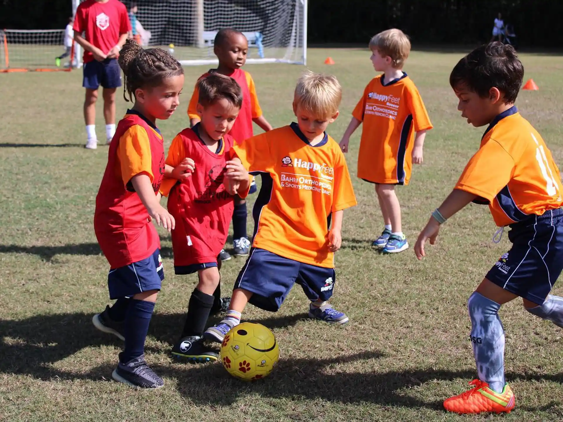 a group of kids playing football