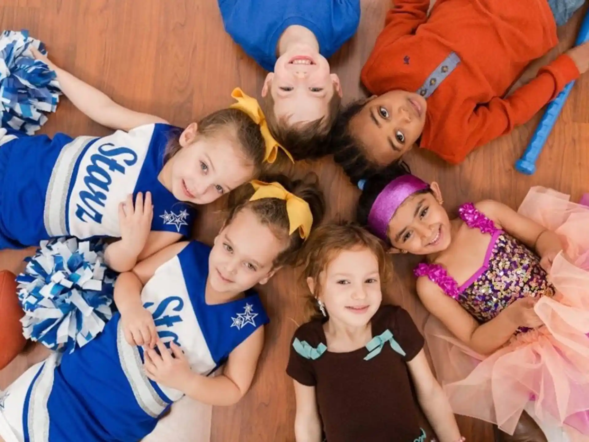 a group of children lying on the ground