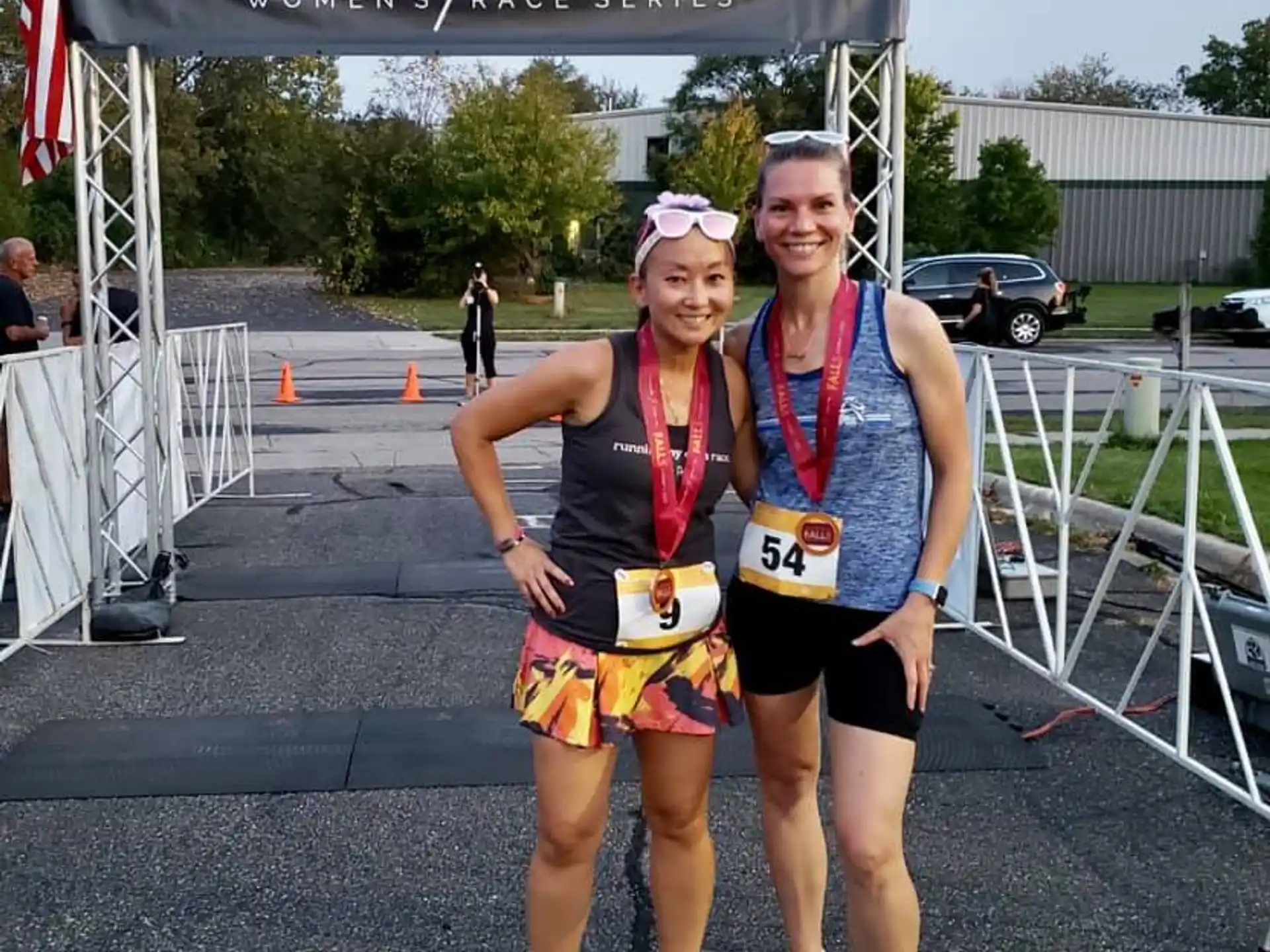 two women wearing medals