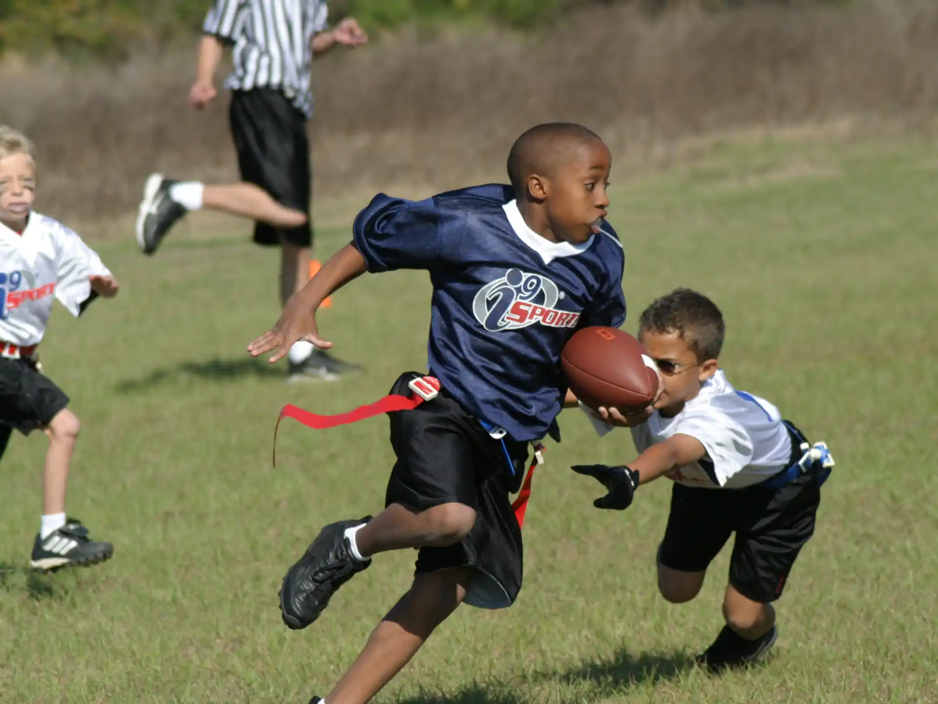 a group of boys playing football