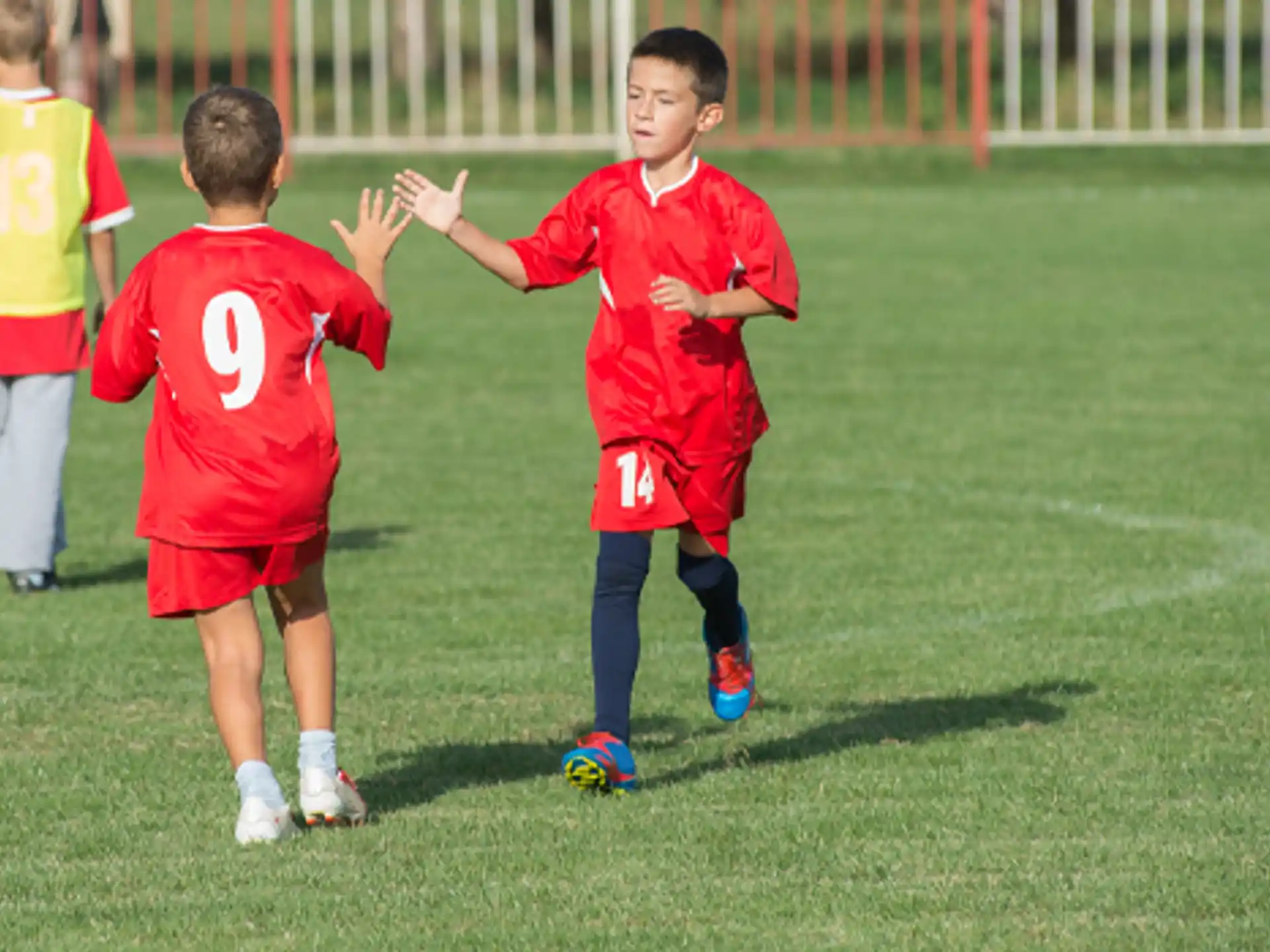 a group of kids playing football
