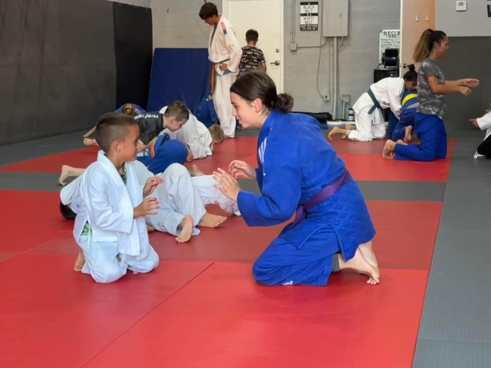 a group of children in a karate class