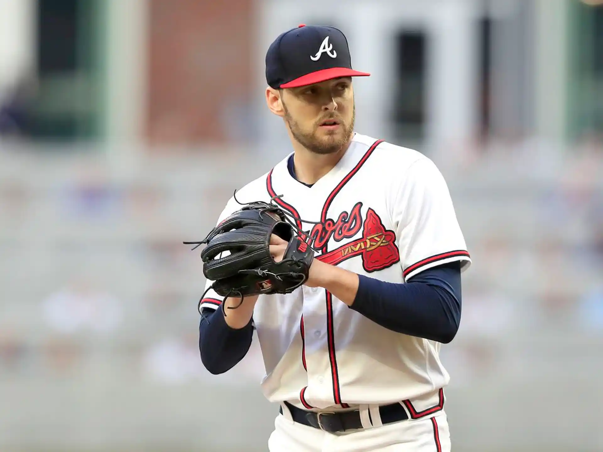a baseball player in a red hat