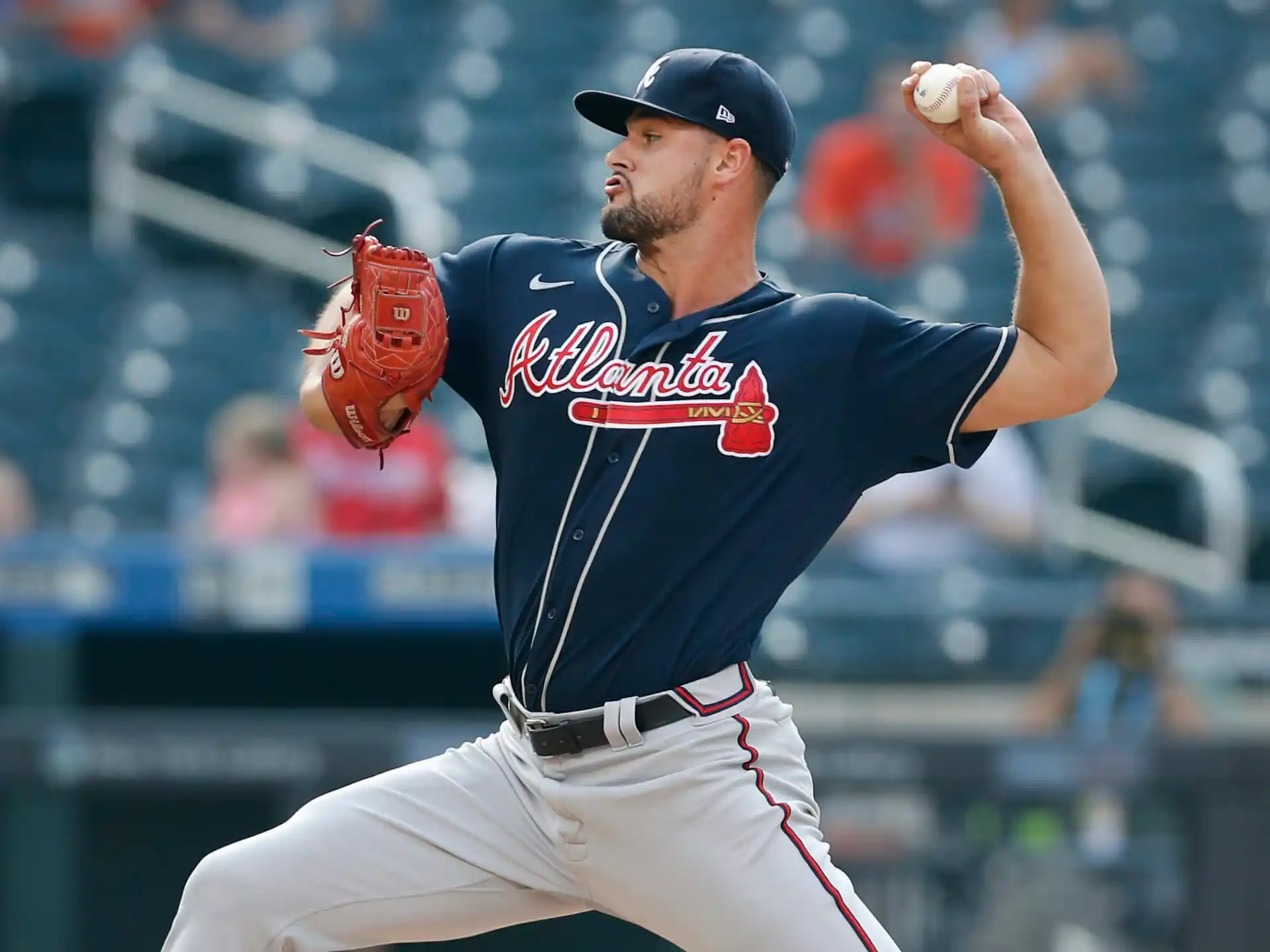 a baseball player throwing a ball
