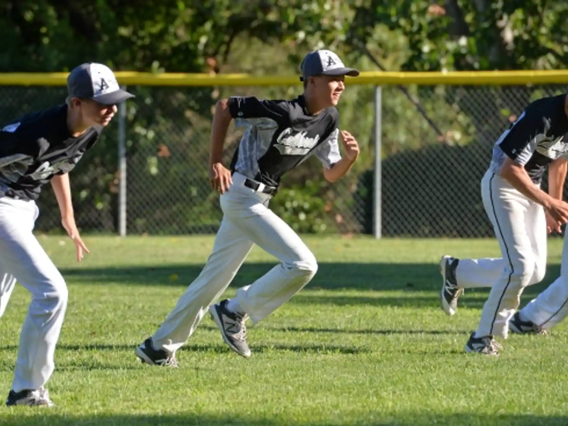 a group of people playing baseball