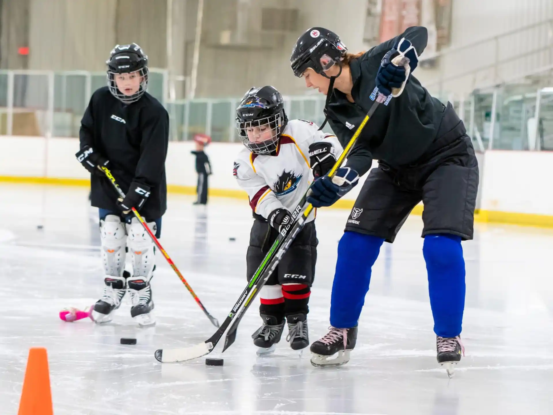 a group of people playing hockey