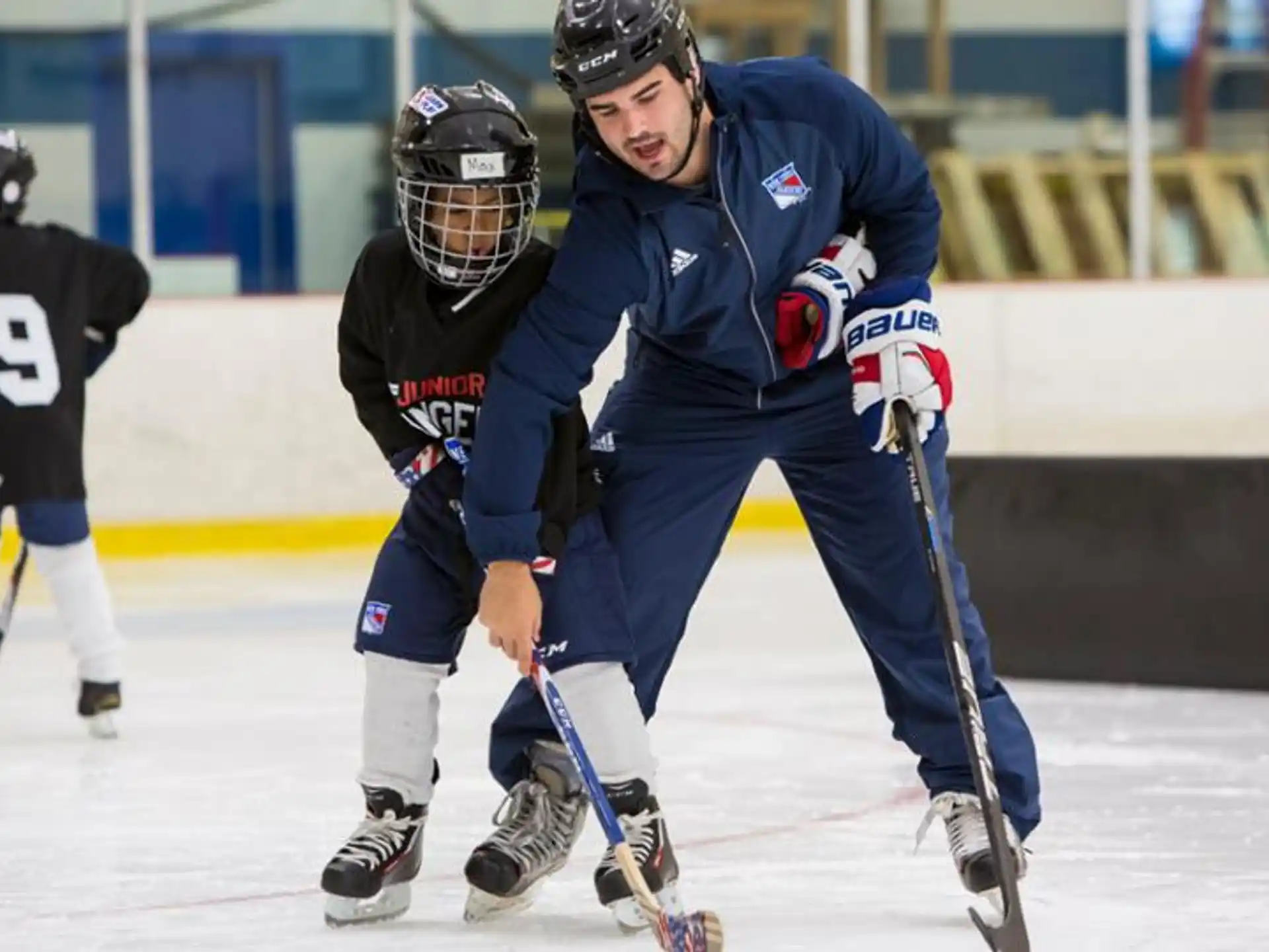 a group of people playing hockey