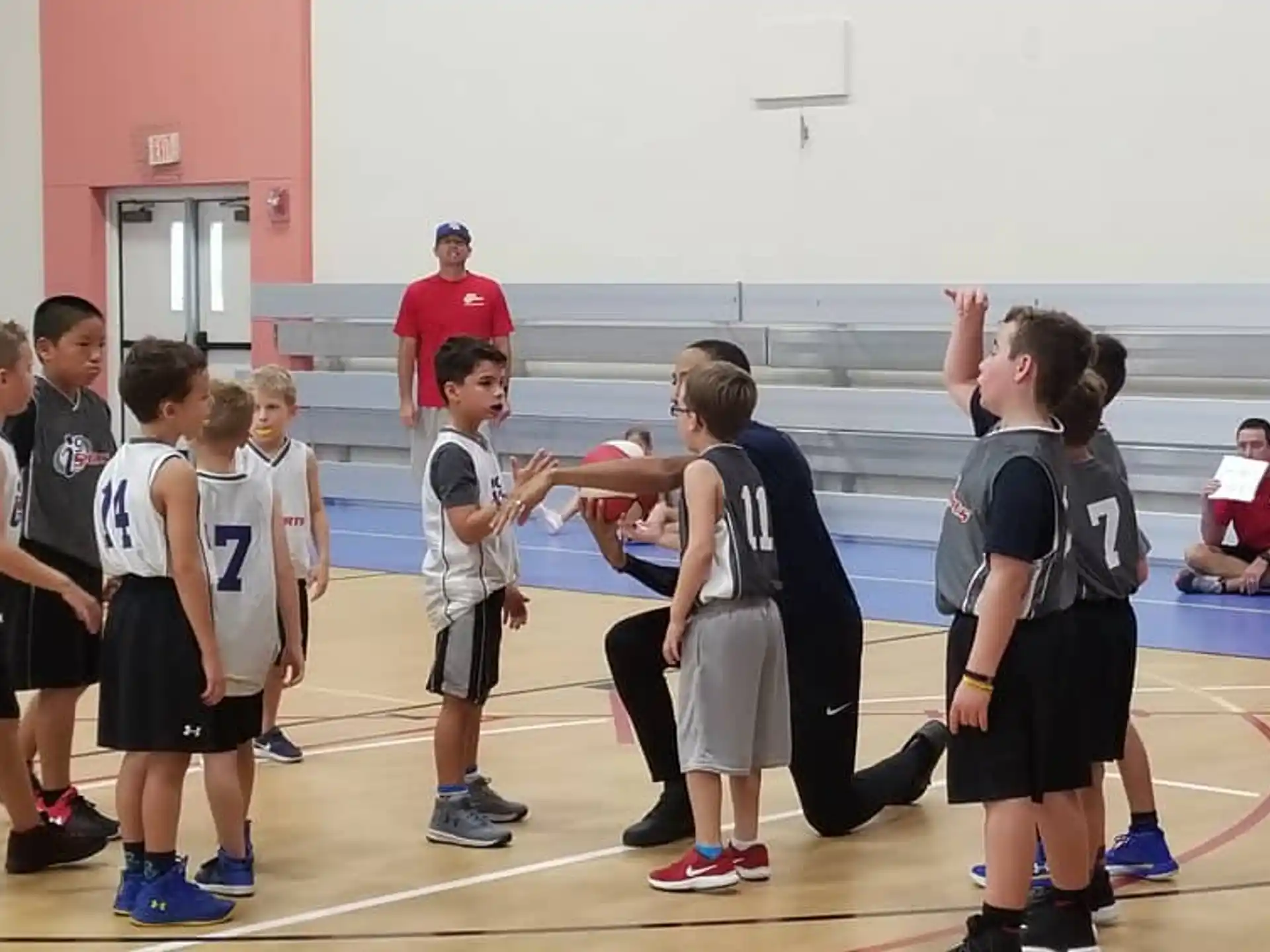a group of kids in a gym