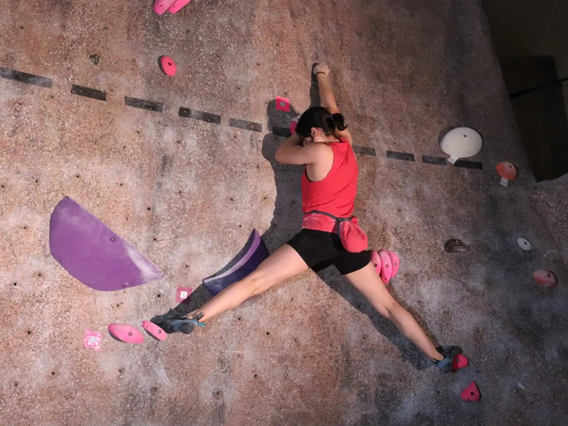 a person climbing a rock wall
