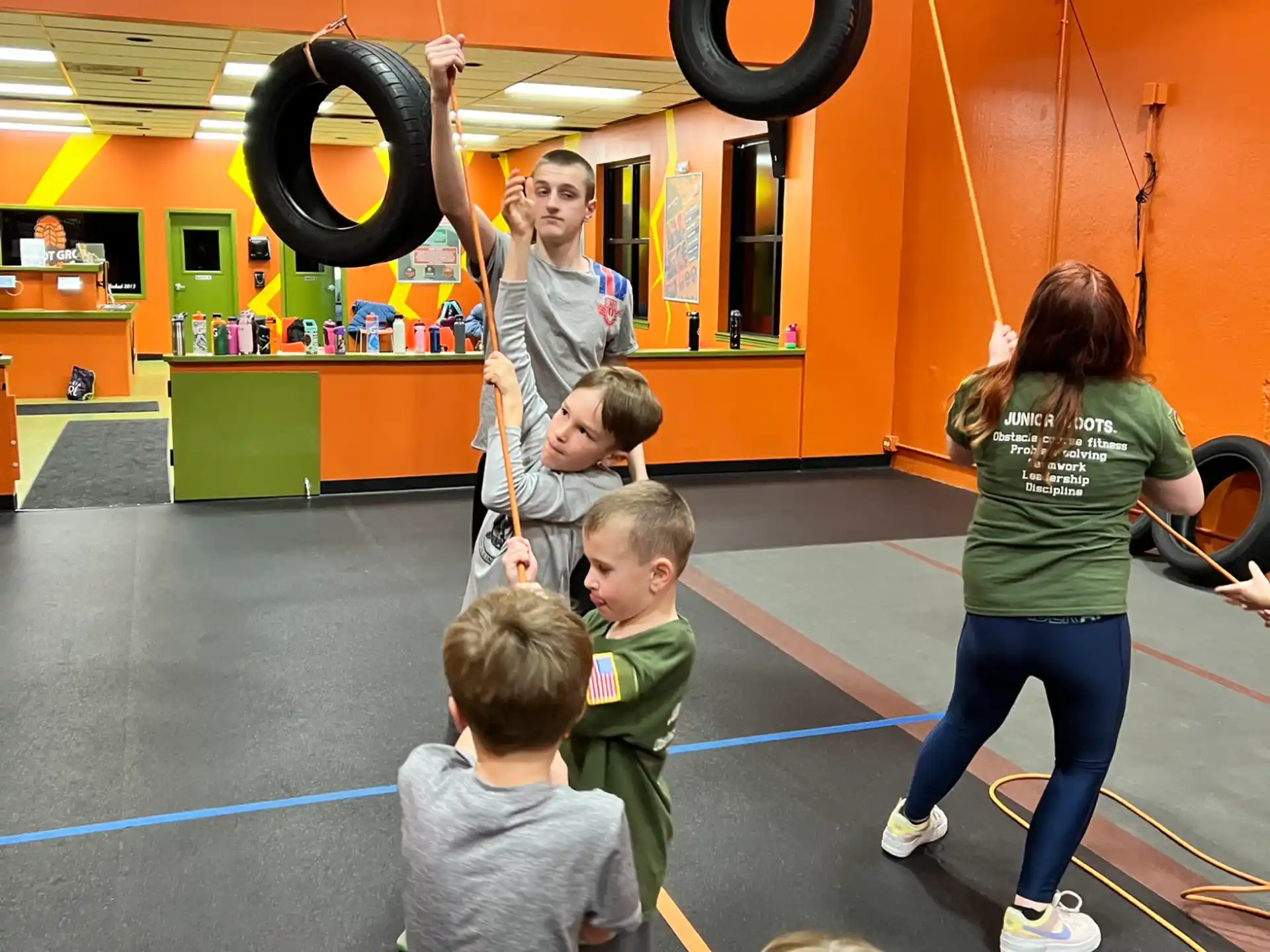 a group of kids playing basketball