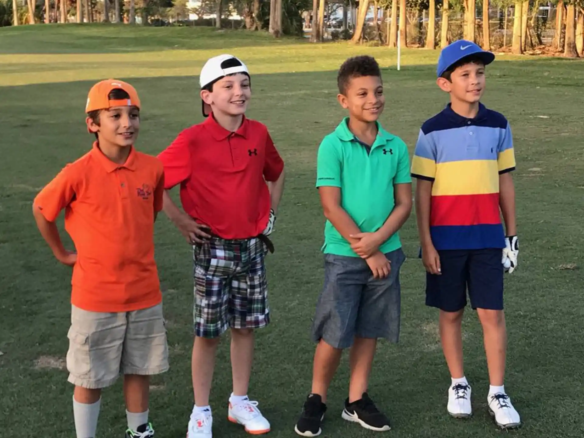 a group of boys standing in a field