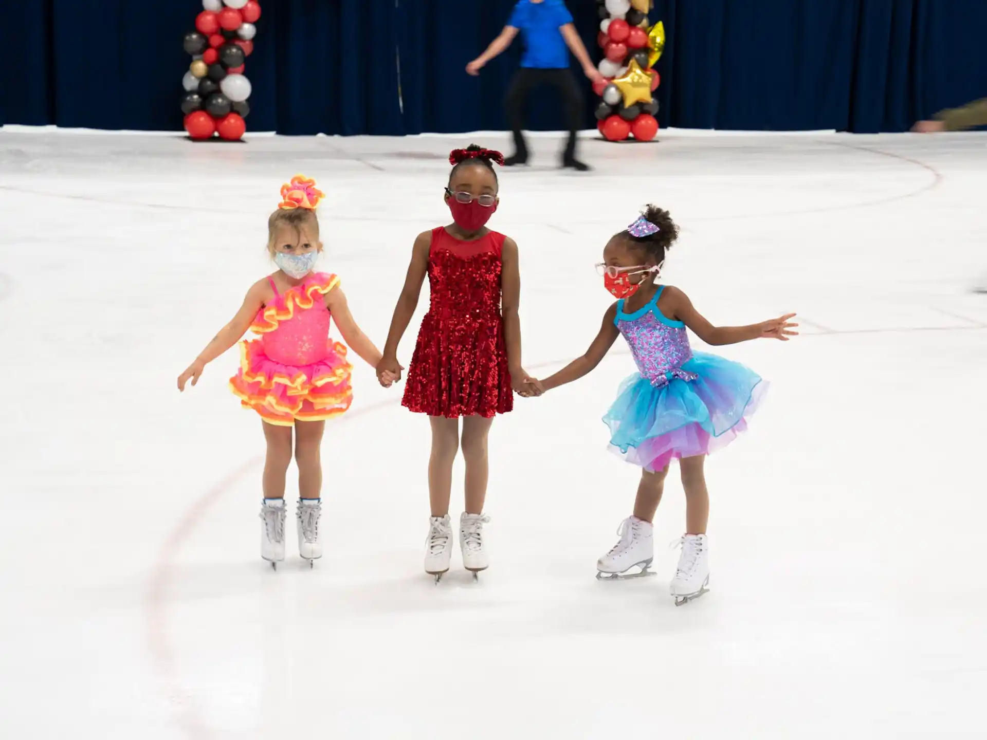 a group of girls ice skating