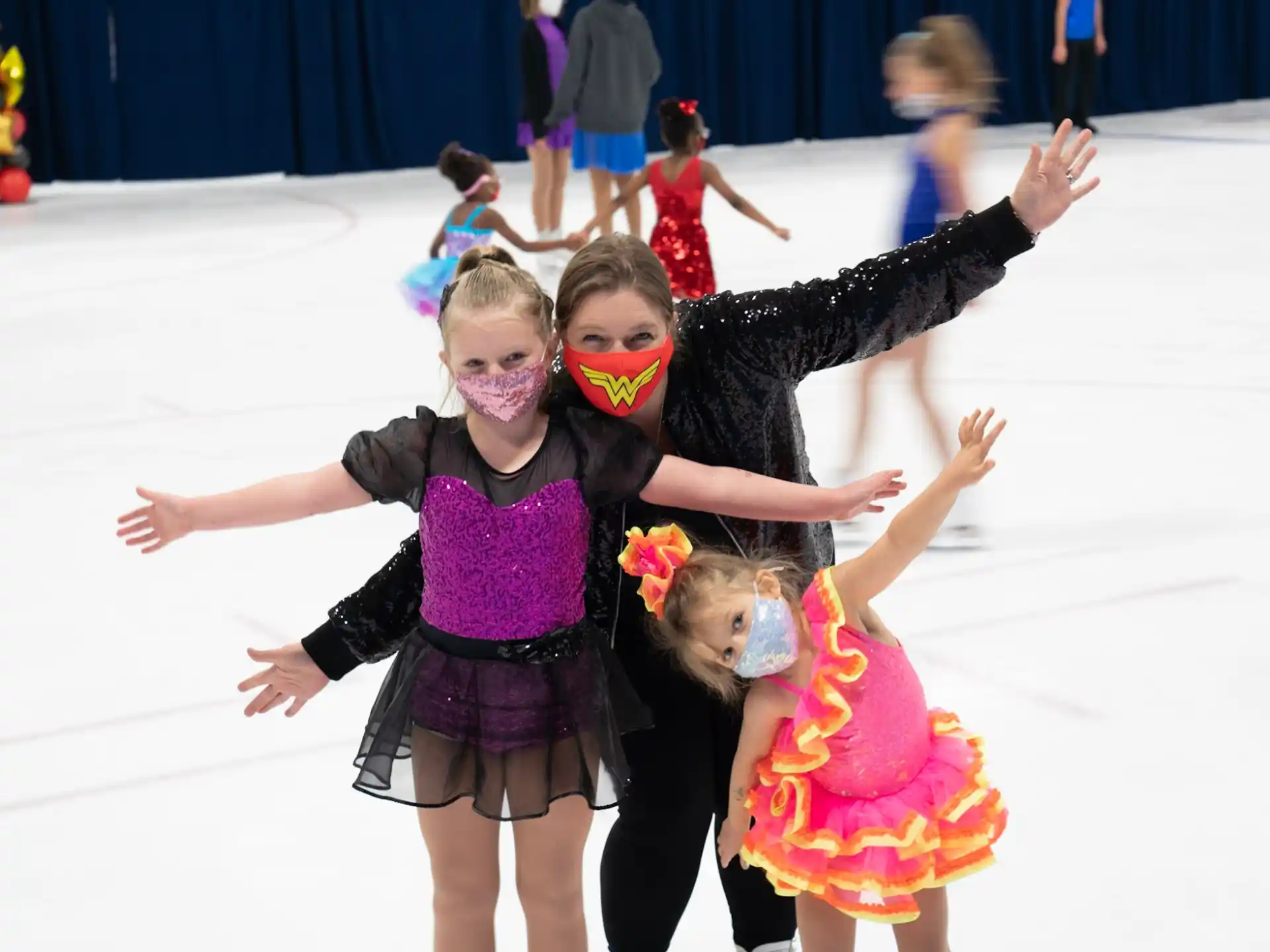 a group of girls ice skating