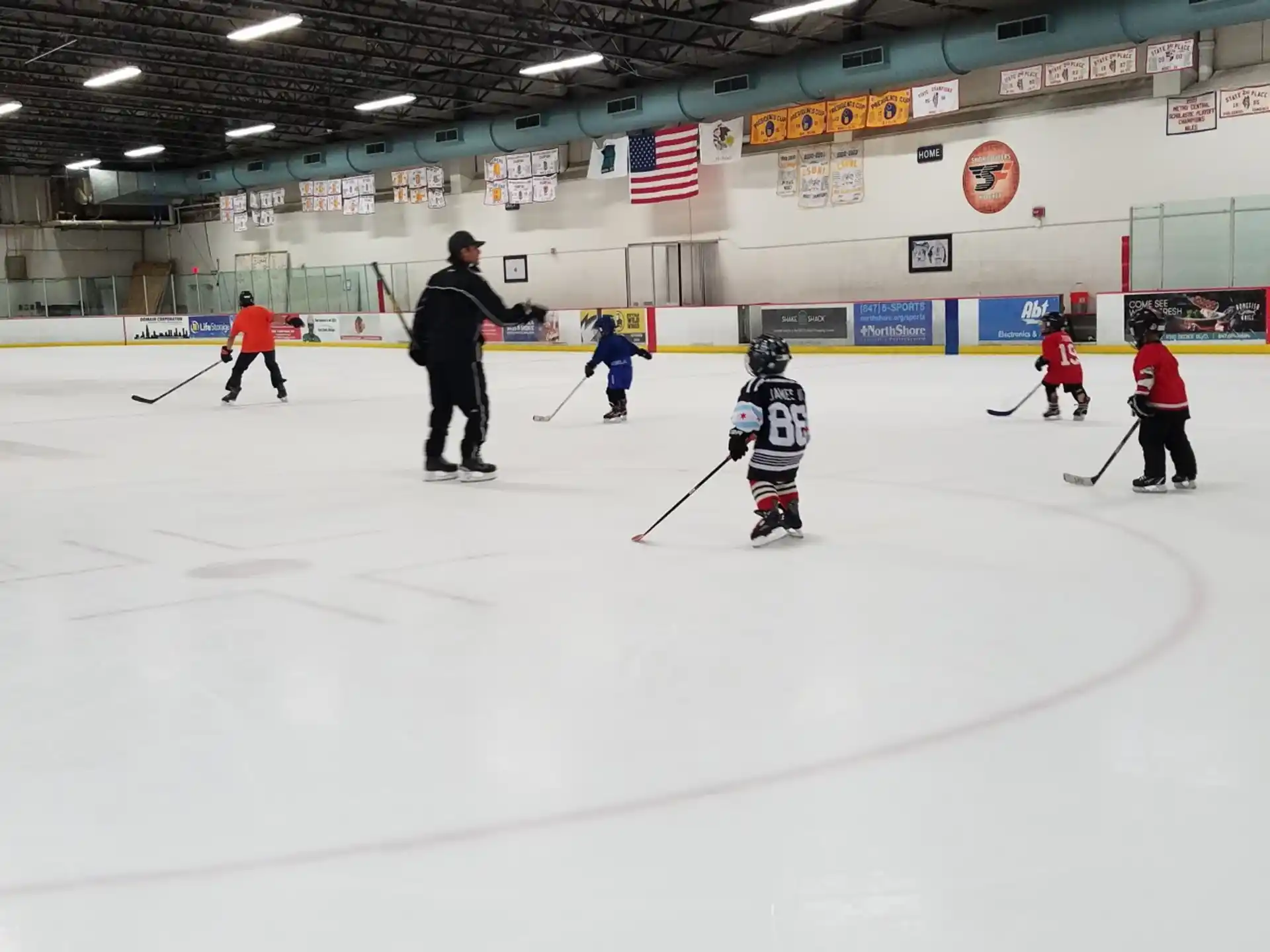 a group of people playing hockey