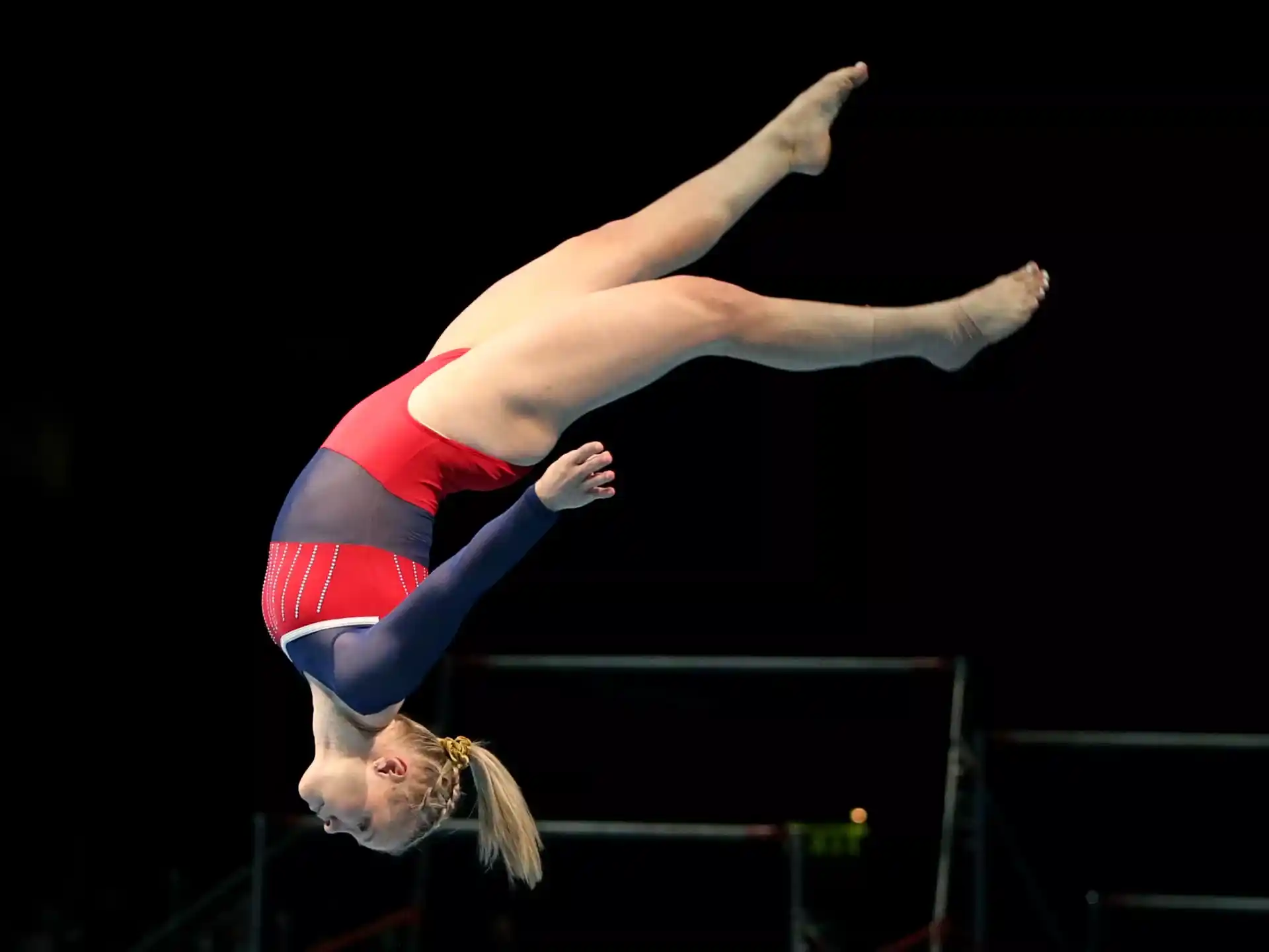 a woman doing a handstand