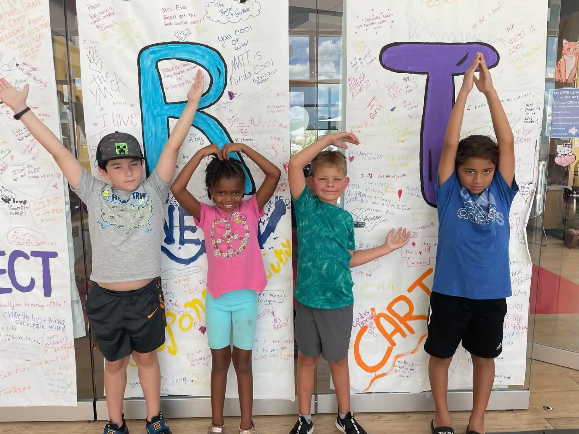 a group of kids posing for a picture