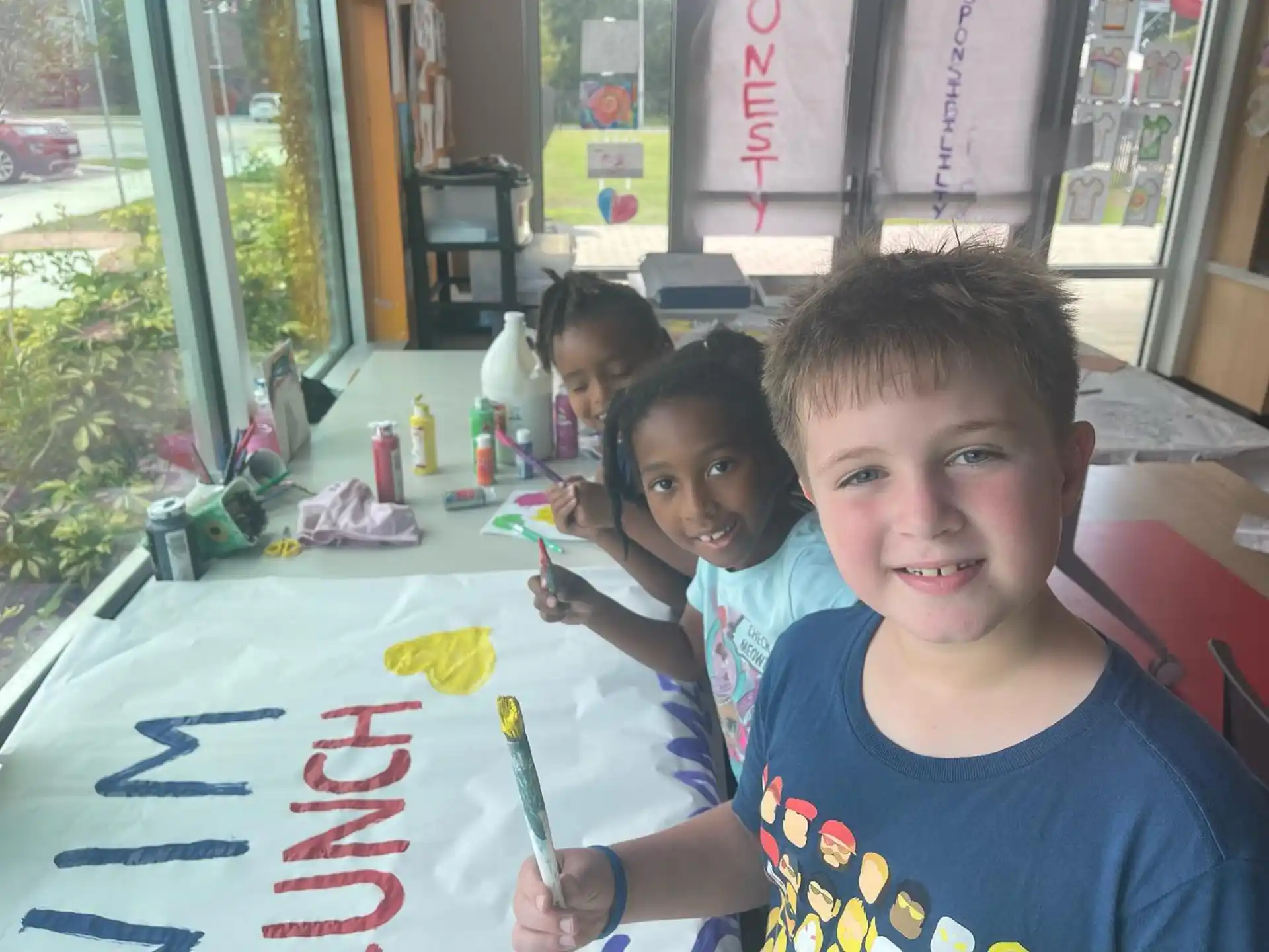 a group of kids sitting at a table