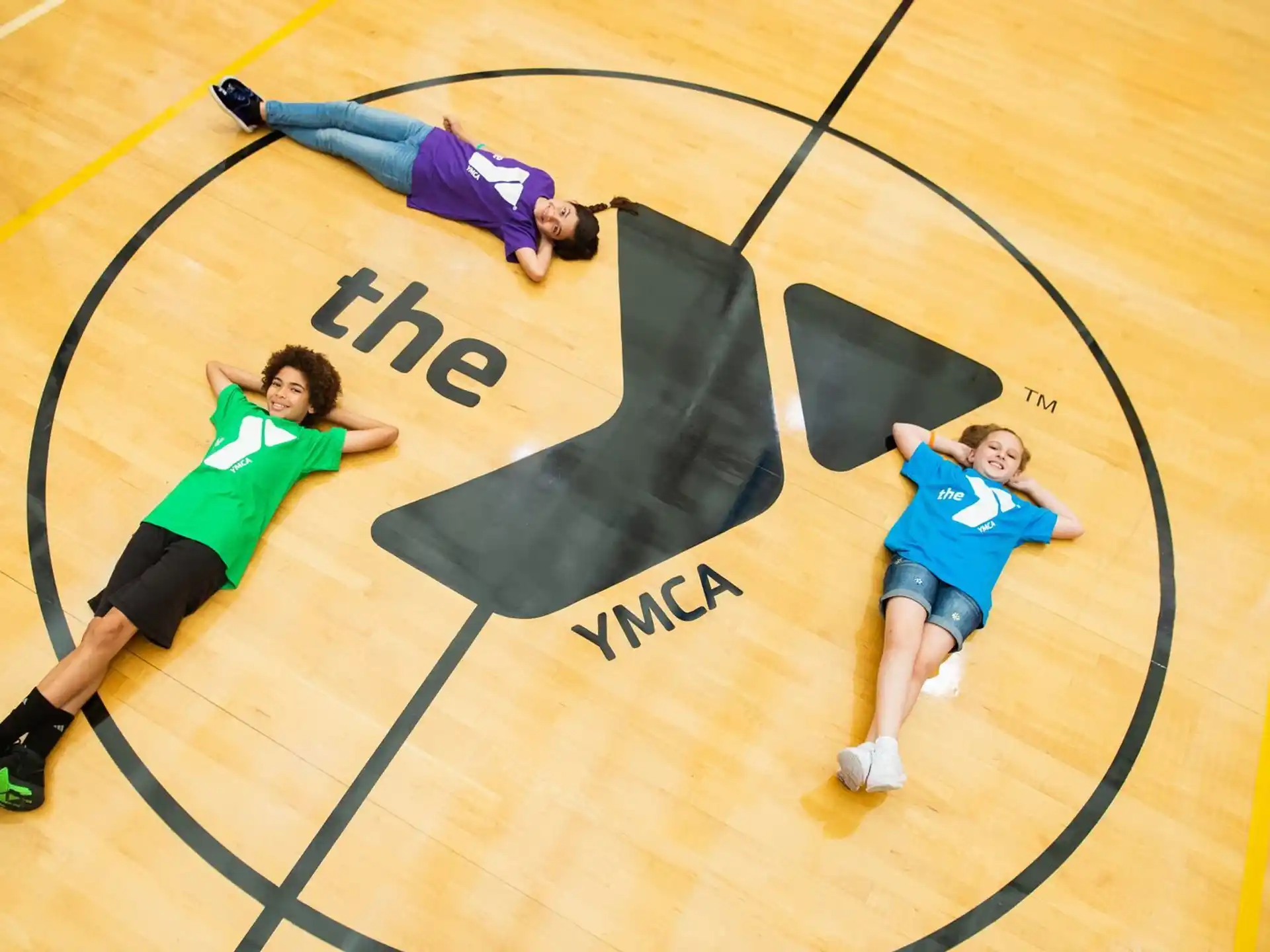 a group of people on a basketball court