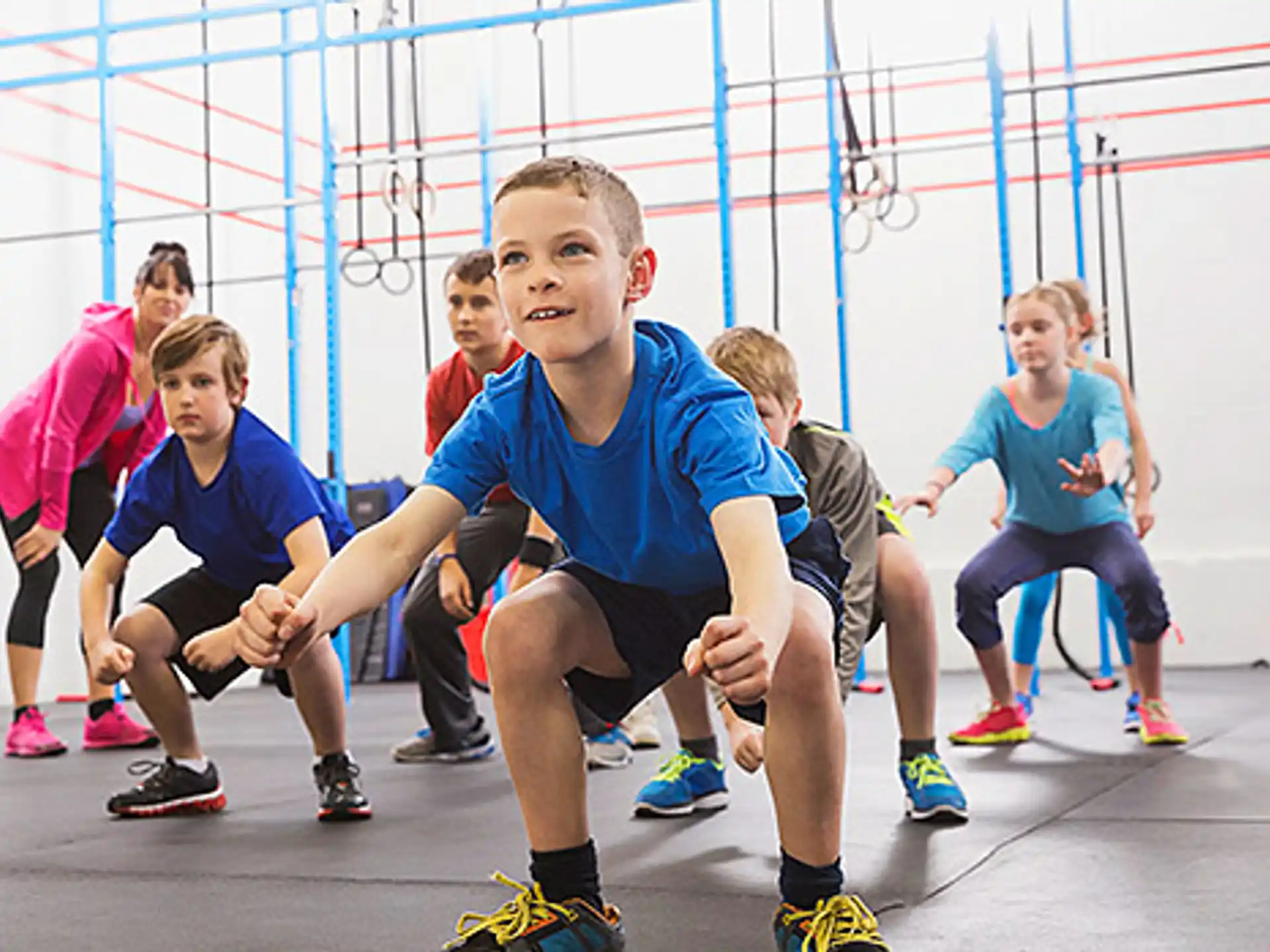 a group of kids in a gym