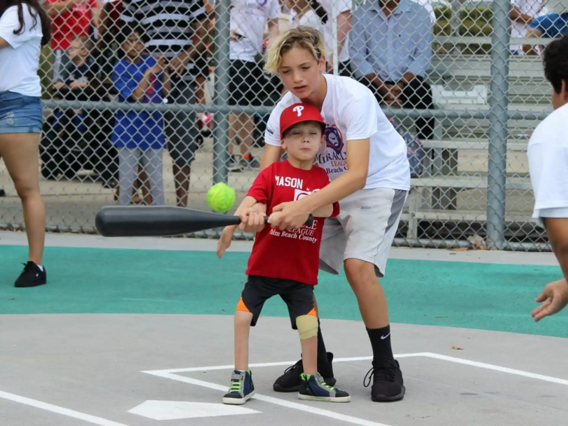 a person hitting a ball with a bat
